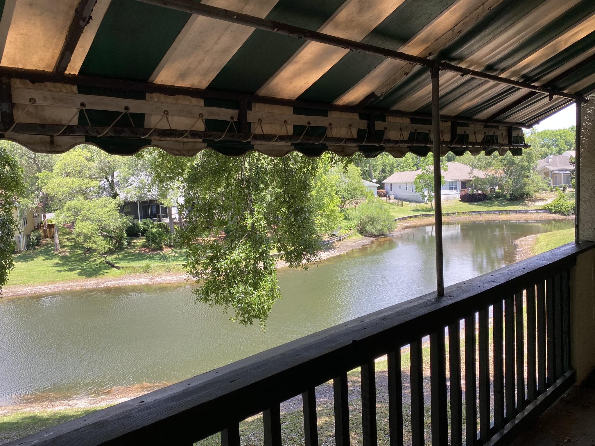 **UNDER CONTRACT** Seller accepting backup offers.
Bluewater Bay is a very sought after community in Niceville and safe + convenient for military families. Golf course, tennis courts, walking and bike paths, close to Schooners bar, restaurant and boat club.
This is a two story condo on 2nd and 3rd floor of the building, located in a quiet area of the complex with a peaceful view of the lake from your porch.
As you enter there are stairs on your right and a bedroom and bathroom on your left. This bedroom is perfect for a guest, teenager, or a roommate. Upstairs boasts a large master with double doors and windows with a view of the lake. Master bath has double sinks and closet area. Other bedroom upstairs has a beautiful skylight!