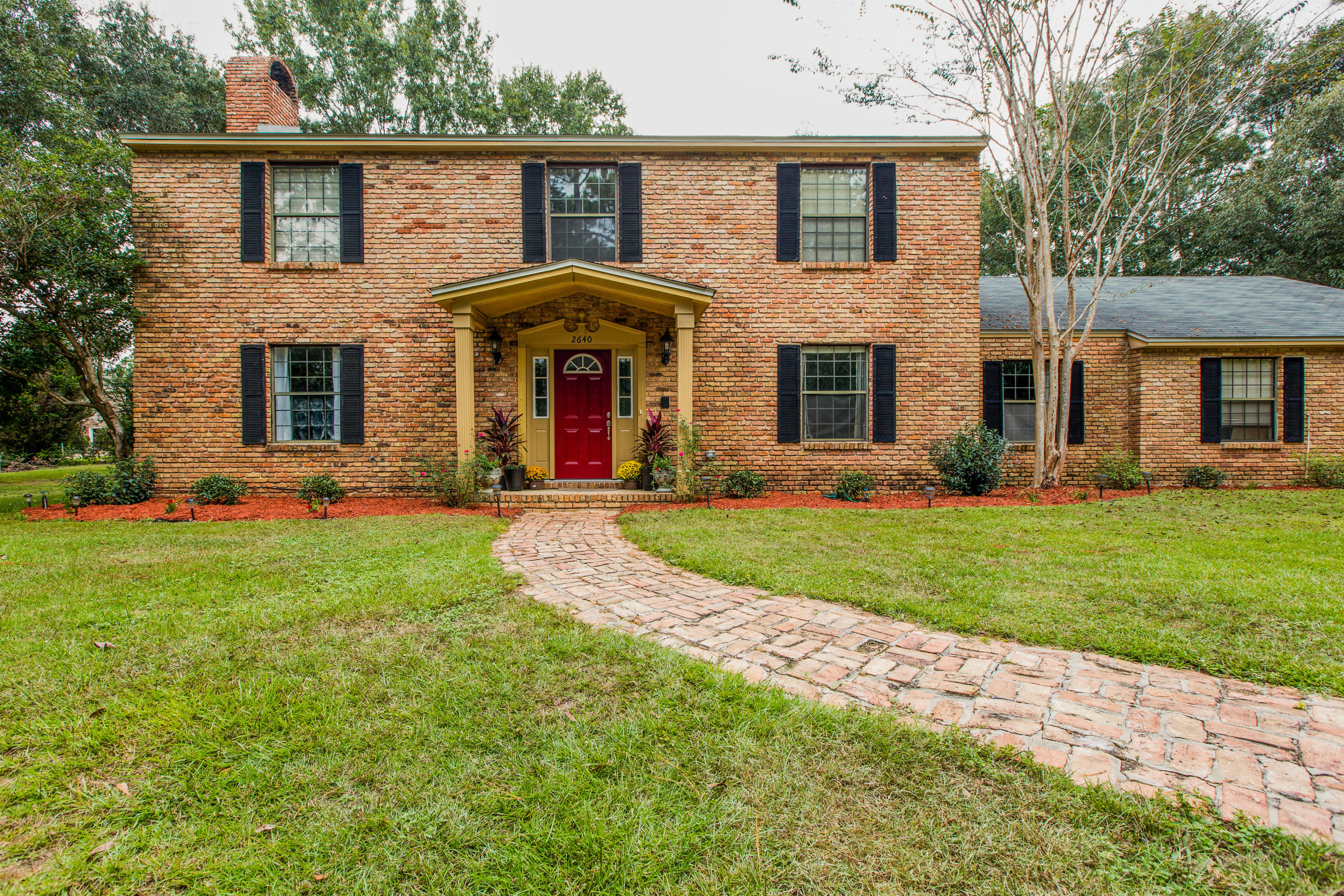 This colonial-style home boasts large rooms and tons of upgrades! The merlot-colored front door (new in 2017) leads you to the open, bright two-story foyer. The extra storage begins here with a hidden oversized closet beneath the stairs beside the half bath (renovated in 2015). To the left is a living room sized to easily fit the largest furniture you have. Grab a book from the built-in bookshelves on either side of the window seat and snuggle up to the wood-burning fireplace. Venture into the fully upgraded kitchen (2016) where you'll find plenty of light and an island featuring a butcher block styled countertop for the true chef in your family... This colonial-style home boasts large rooms and tons of upgrades! The merlot-colored front door (new in 2017) leads you to the open, bright two-story foyer. The extra storage begins here with a hidden oversized closet beneath the stairs beside the half bath (renovated in 2015). To the left is a living room sized to easily fit the largest furniture you have. Grab a book from the built-in bookshelves on either side of the window seat and snuggle up to the wood-burning fireplace. Venture into the fully upgraded kitchen (2016) where you'll find plenty of light and an island featuring a butcher block styled countertop for the true chef in your family. The island is surrounded by upgraded appliances (2014), granite countertops (2016), lots of cabinet space and a breakfast nook. To the right is your large dining room with plenty of light and new flooring (2014). Just beyond the kitchen is a bedroom that includes a huge closet and direct access to the kitchen, carport, and laundry room.  In the laundry room, you'll find plenty of countertop and cabinet space, a sink, and an ironing board closet. Upstairs to the right are two more additional bedrooms each with their own upgraded bathrooms (2015) and large closets. The master bedroom is on the opposite side upstairs with room enough for all of your bedroom furniture plus some! The bathroom hosts even more cabinet space and granite countertops for both vanities (2015). Both the garden tub and the walk-in shower were renovated in 2015. New roof in 2014 with reinforcement, storm shutters, and new egress door added in 2017 with the Rebuild NW Florida project.  The large yard includes a circle driveway to accent the easily manicured landscape. Stay straight on the driveway to take you to the oversized 2-car carport with a fully enclosed storage room. Just a few more steps will lead you to the huge ~12x20 ft workshop with loft space and awning for a 4-wheeler and/or lawnmower. The backyard is also large and becomes a paradise as you grill on the open patio or dine in the covered patio. New HVAC units and hot water heater in 2015. Washer, dryer, and freezer in laundry room do not convey. Intercom/speaker and sprinkler systems convey as-is.