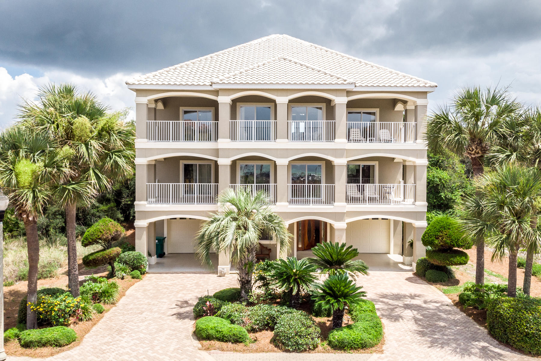 Gulf views, superior construction, and premier beach location in Destin's sought-after gated community Destiny (West). This single-owner home has never been rented and has been well maintained throughout ownership. With some updates and a pool, this 7-bedroom home can transform into a powerhouse vacation rental, producing over $180K per yr. Straight lines, open floor plan, and neutral finishes allow easy modification for personal tastes. Open air space is significant with 2,000 sqft of deep tiled balconies plus a yard with room for a pool. Three stories of large windows illume the interiors with Florida sunlight. Corridor Gulf views are permanent, and beach access is just a short stroll away. This coastal home upholds superior structural integrity with advanced 2x6 framing, rebar in walls, and engineer stamp of approval trusses. Recent improvements include new kitchen counters and backsplash, stainless LG appliances, interior paint, and 80 gal water heater. Roof is comprised of Monier "Life" 50-year tile (est 1998). Short-term seller financing offered with significant down. Sold furnished excluding art. Destiny (West) is a private, gated community located in East Destin. Luxury amenities include a fitness room, community pool, tennis, playground, fishing, and pavilion/gazebo.
