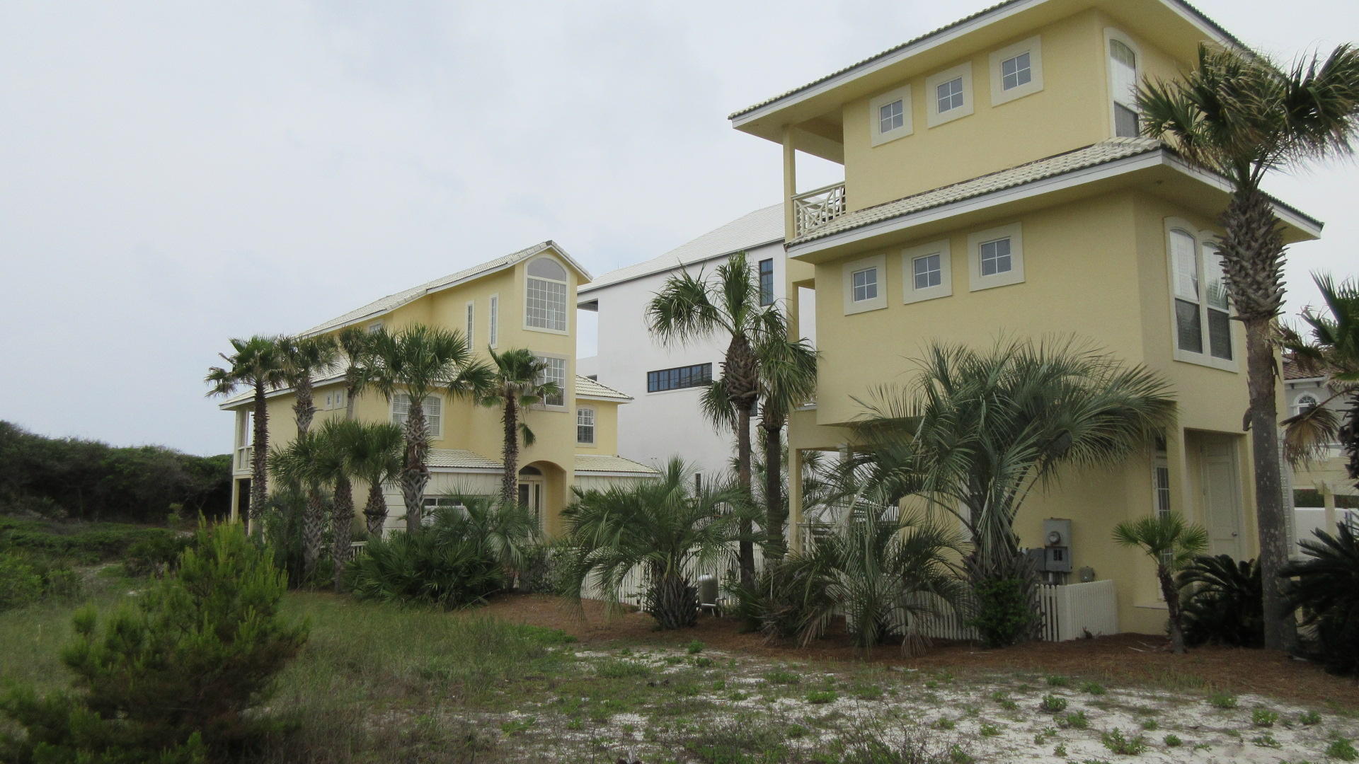 A $200,000 REMODEL ALLOWANCE TO BUYER WITH AN ACCEPTABLE OFFER! THIS LOVELY 3 STORY, 7 BEDROOM, 4 1/2 BATH GULF FRONT HOME & 3 STORY, 2 BEDROOM, 2 1/2 BATH CARRIGE HOUSE IS LOCATED IN THE PRIVATE GATED COMMUNITY OF PARADISE BY THE SEA, SITUATED ON ONE OF THE HIGHEST BLUFFS & OVERLOOKING THE COLORFUL WATERS OF THE GULF OF MEXICO. THIS IS A GREAT INVESTMENT AS A RENTAL PROPERTY OR WOULD BE A NICE LOCATION FOR YOUR PERMANENT OR VACATION HOME. SPECIAL FEATURES INCLUDE; INGROUND POOL, PRIVATE WALKWAY TO THE BEACH, BALCONIES, OPEN & COVERED DECKS, OUTSIDE SHOWER, ELEVATOR, TILE & HARDWOOD FLOORS, CROWN MOULDING, HAND PLASTERED INTERIOR WALLS, SOLID SURFACE CORIAN COUNTER TOPS, AND SO MUCH MORE!!! CONVENIENTLY LOCATED TO CASUAL & FINE DINING, UNIQUE BOUTIQUE SHOPPING, & CHALLENGING GOLF COURSES. JUMP OUT ON HWY 98 TO VISIT THE ATTRACTIONS ON PANAMA CITY BEACH OR  DRIVE OVER TO DESTIN TO ENJOY OTHER ENTERTAINMENT OPTIONS. HOME TO BE SOLD "AS IS" WITH THE RIGHT TO INSPECT. THE SELLER MAY WANT TO DO A 1031 EXCHANGE AT NO COST OR LIABILITY TO THE BUYER'S. BUYER'S TO VERIFY ALL INFORMATION INCLUDING LOT DIMENSIONS.