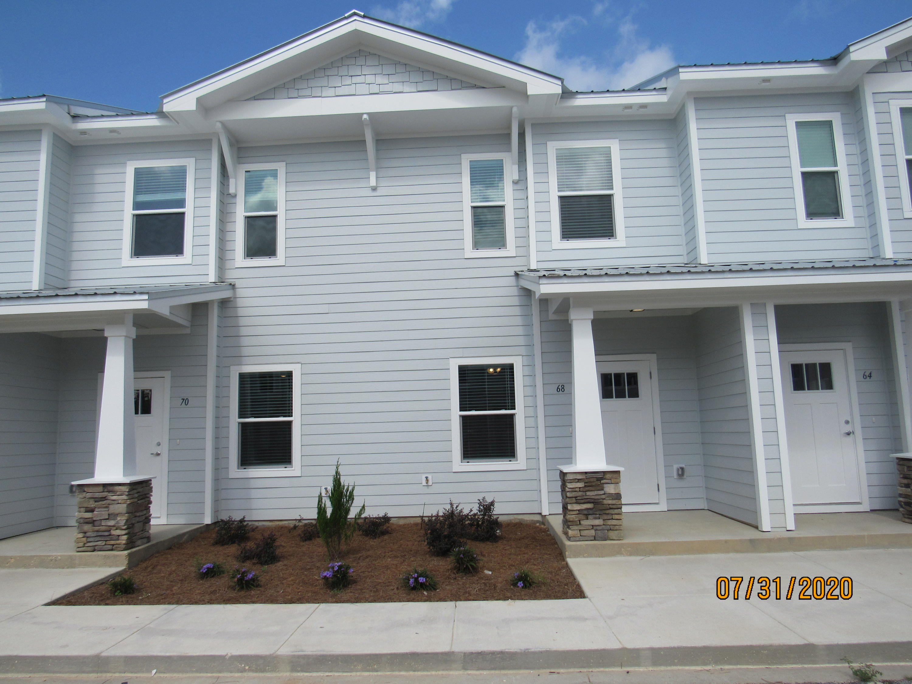 BRAND NEW, never lived in, 2 bedroom, 2.5 bath town home with upgrades and a community pool! This lovely home is across the street from an elementary school, just down the road from a Publix shopping center, and a short, easy commute to the sugar sand beaches and emerald waters of 30a/SOWAL. It has fresh, neutral paint and no carpet throughout. The open floor plan on the first level includes a nice size living room with nook, eat-in kitchen with breakfast bar, gorgeous counter tops, plenty of counter/cabinet space, stainless appliances (including a flat cook top stove), and a beautiful back splash, as well as a half guest bath with pedestal sink and a screened-in back porch. Upstairs, you will find two spacious bedrooms, each with their own full bath. Also upstairs are the laundry hookups (washer and dryer included in rental). There is plenty of storage. Pool care, lawn care, and garbage included in the rent. Pets may be considered on a case-by-case basis with prior owner approval and a non-refundable pet fee. NO SMOKING.