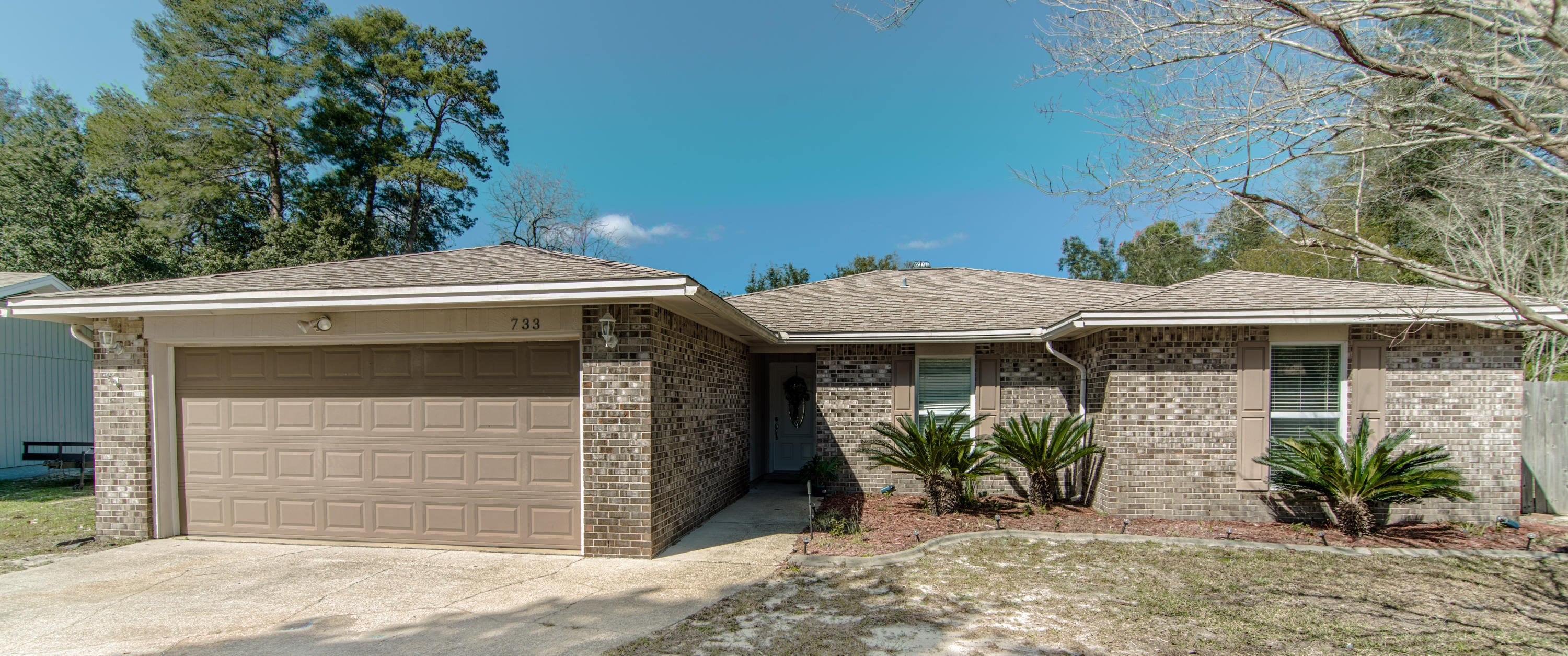 Add your own touches to the most affordable 4 bedroom brick home in all of Bluewater Bay! At under $270,000, you won't find so many features in one of the best school districts in the area! Don't let the age (1978) of this house fool you, this well-maintained cul-de-sac home in a quiet corner of Caribbean Village offers a huge fenced yard, a rare find in this neighborhood. This LARGE yard (.36 ac) is the perfect blank canvas to make into a grand retreat over timeadd a large pool, widen the gate and park your boat, so convenient to the baythere are so many possibilities! The backyard includes a fantastic oversized storage shed/workshop! The back porch includes a utility sink and stub-out for gas-perfect for creating your own outdoor kitchen space. St. Thomas Cove is close to Bluewater Elementary, just a few blocks from White Point Recreation area, Bluewater Bay Resort/Golfing, boating, easy Mid-Bay bridge access and all that Destin & its beaches have to offer!    

Enter into a Lovely Grand Room with nice wood-burning fireplace and pecan laminate wood flooring throughout the main living area. It adjoins a cozy dining room, conveniently flowing into the updated kitchen, with tons of storage in the beautiful cabinets with Silestone countertops, and tile flooring. The huge bonus room on the back, is great space for your "Man Cave", Craft room, or play room, or maybe all 3! The Master Suite is just down the hall from the other 3 bedrooms, with newer carpet-great for a young family! Move-in ready in a great neighborhood!

733 Saint Thomas Improvements
	
Air Conditioning Compressor 2015
Water Heater 2015
Roof 2006
Duct Work replaced 2010
	Air Conditioner Overhaul 2010
	Flooring
		New Laminate Wood flooring in Living and Dining Feb 2016
		Tile 2010
		New Carpets April 2015
	Paint
		Most all 2015-2016
	Garage Floor April 2015
	New Front Door April 2015
	
Inclusions
	Washer
	Dryer
	Refrigerator
	Stove and Microwave
	Dishwasher

	Old Republic Home Warranty