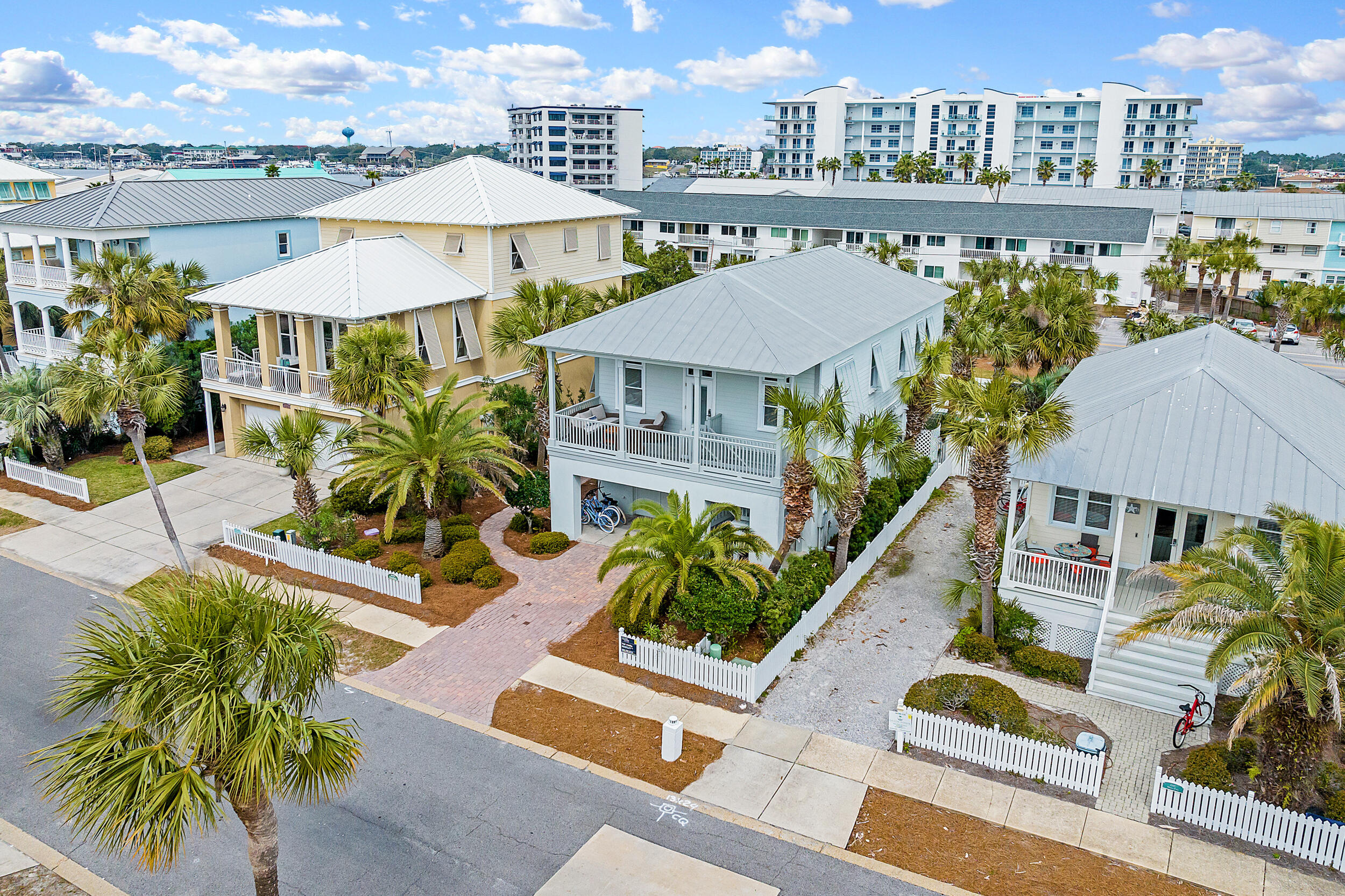 Coastal Cottage in a private resort community-Destin Pointe! A welcoming 3br/4ba split floorplan offers a 3br/3ba 2 level resort home AND a BONUS large poolside FULL APARTMENT on gr floor w/separate side access. High ceilings & many windows provide flowing natural light and an aire of charm. Comfort is key w/easy care flooring, granite counters, 2 Newly remodeled baths and kitchen. Master w/ensuite bath & stairs to pool. 1st fl golf cart garage. Lg APT suite w/ LR, kitchenette/bar, bath Qbunks & Tbunk alcove - French doors lead to fenced yard w/cozy courtyard pool, firepit area/sundeck w/privacy wall. Great Rental. Enjoy all Destin Pointe offers- gated entry, 2 resort pools, 2 beach accesses, pickleball cts, bike ride or seasonal tram, tennis, fitness + shuffleboard. Your Dream Beach Home!
