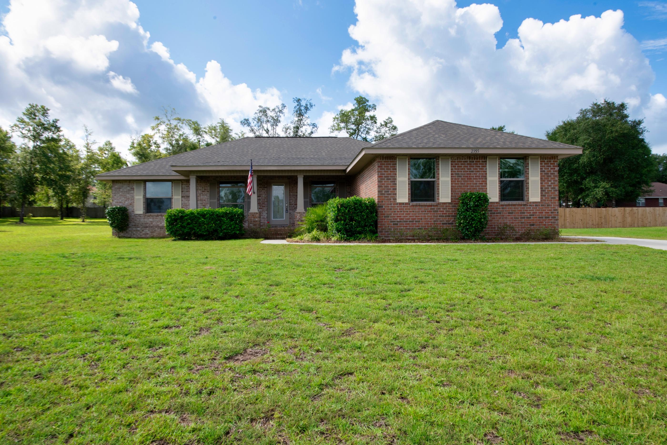Beautiful brick home with spacious yard.  This home features wall to wall plush carpet and tile in kitchen and bath and trayed ceilings.  Kitchen has plenty of space in cabinets and pantry, stainless steel appliances, granite counter tops and a breakfast bar that complements the dining area. Master bathroom has large garden tub and 2 walk in closets.Outside you will find a newly enclosed patio room and green roofed shed for additional storage space.  The home also features a side entry garage.