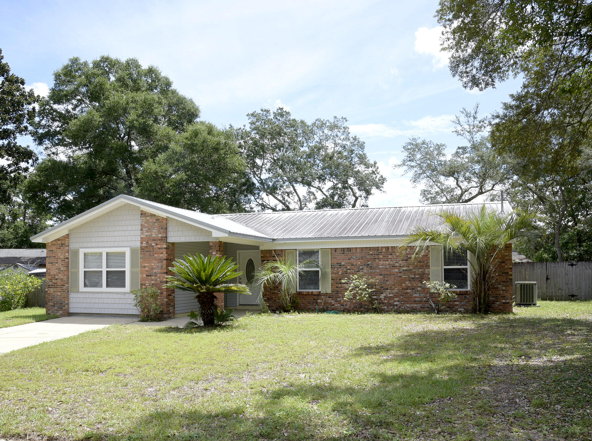 This Niceville home is conveniently located to schools, bases and beaches. As you walk in the door you are greeted by a spacious living room, with a beautiful fireplace & laminate flooring. Each bedroom has plenty of closet space. You will enjoy the private office area off of the kitchen, also a great space for an entertainment room or play area. The large utility room has lots of space for storage options. Fenced-in backyard, as well more storage space with the detached storage unit. Owner will consider pets with restrictions. Any pet must be spayed/neutered, housebroken & current on all shots. NO PUPPIES! Requires a non refundable pet fee. NO SMOKING! Any person 18 years old or older must apply separately. Tenants required to carry renter's liability insurance. Ice Maker not warranted