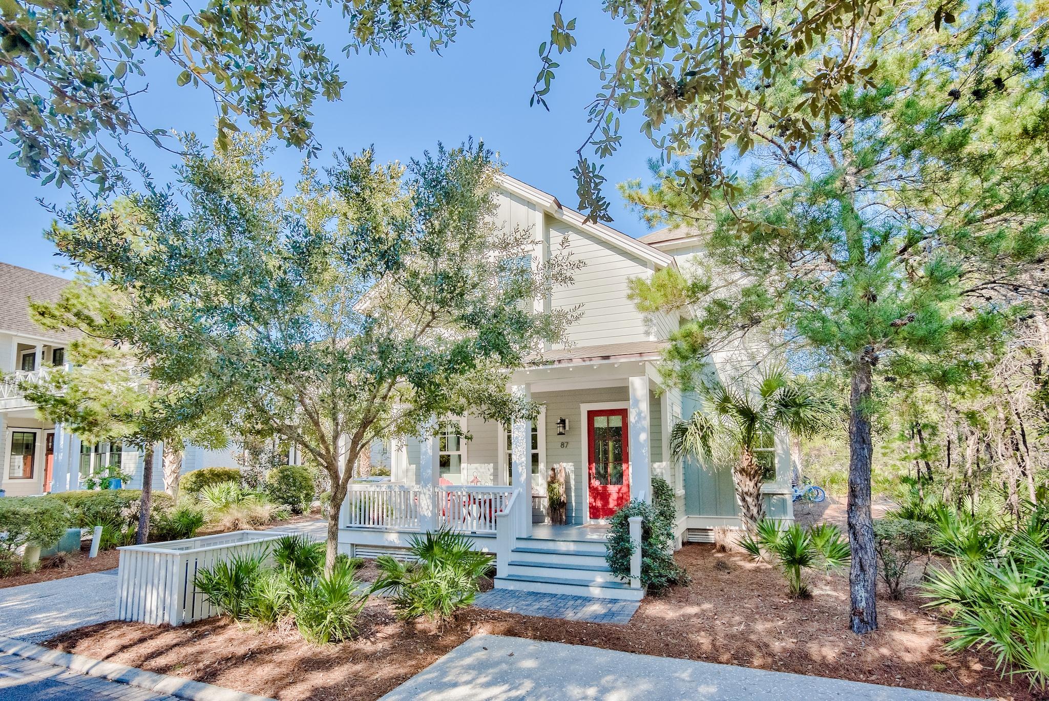 Located behind the private gates of Watersound Beach, this charming beach home boasts over 2,200 square feet of thoughtfully designed living space. Situated on a large lot across from lush green space, the homesite offers privacy and ample outdoor living areas totaling over 500 square feet. The interiors are tastefully adorned with hardwood floors, Pecky Cypress accents, a tabby shell fireplace, Carrara marble, and designer fixtures. The chef inspired kitchen offers ample storage, an oversized island,  and top of the line appliances. The first-floor main suite opens to an open porch and features a sumptuous ensuite bath with modern claw foot tub. The additional three bedrooms feature private ensuites each with custom tile arrangements. With space to add a pool in the backyard and carriage house above the garage if desired, this like-new residence leaves little to be desired. Watersound Beach resides on 1,400 acres and over a mile of private white sugar sand beaches. The culmination of amenities and exclusiveness affords residents with the epitome of private coastal living while remaining geographically poised near the world-class dining and entertainment venues 30A has to offer. 87 Salt Box is a rare and special residence to be cherished by discerning owners for years to come- inquire today to schedule a private viewing.