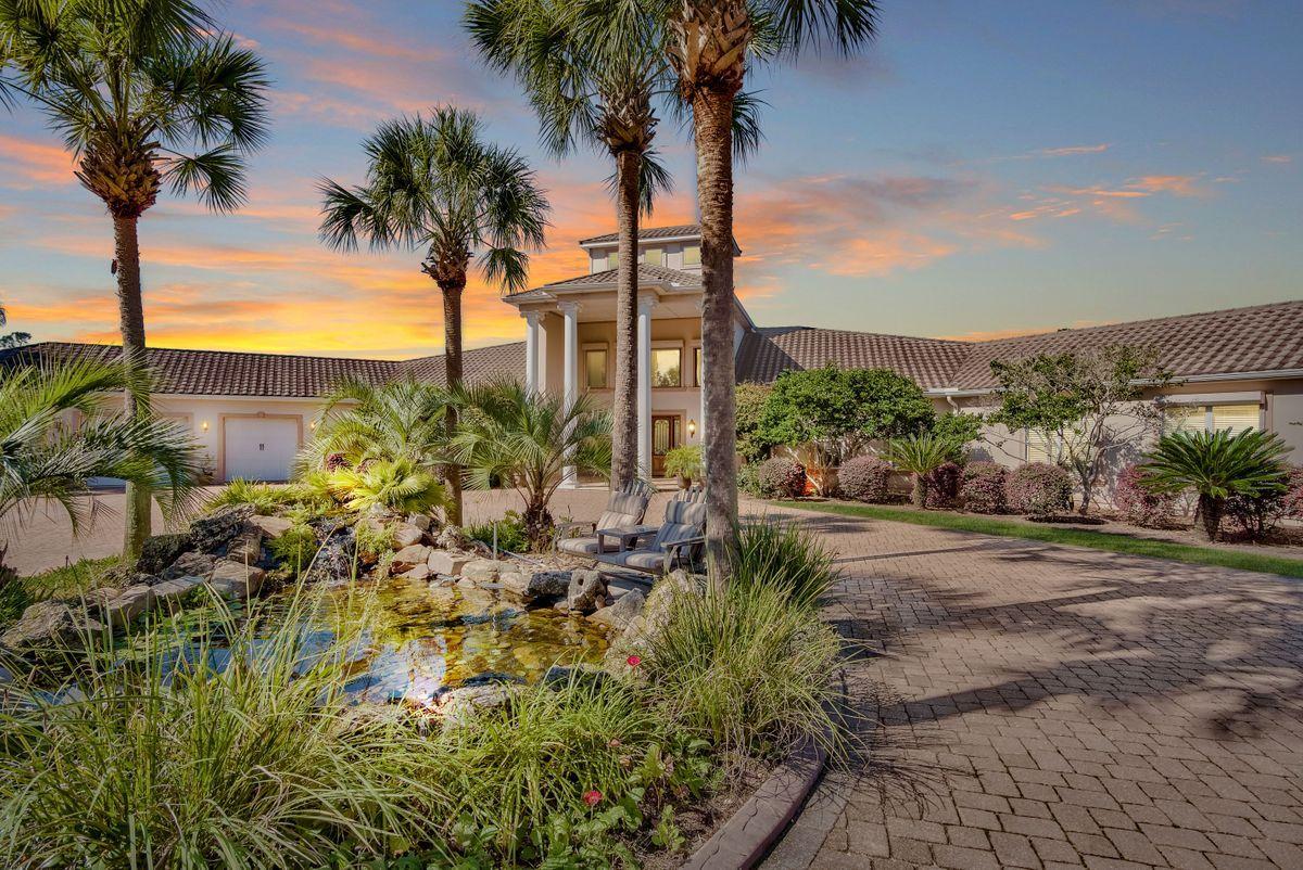 Nestled amid lush rolling pastures with private gated entry is this enchanting, 60-acre equestrian estate that welcomes you with a two-story, naturally-lit entrance overlooking a living room with limestone fireplace. Completed in 2009, the home has 5 bedrooms, 5 full baths, private office space and a large pool within a screened lanai, offering plenty of space to entertain inside and out. The gourmet kitchen features slab granite countertops, oversized island, Wolf appliances, wine cooler, walk-in pantry, custom cabinetry and a dining area overlooking the pool lanai with summer kitchen. The craftsmanship of the wood-coffered ceiling, bookcases and walls in the nearby library makes for a perfect spot to read or write while enjoying the double-sided fireplace. The sleeping wing features two master suites with ensuite baths and spacious walk-in closets. Guests will enjoy their own accommodations with ensuite baths, exercise room and extra-large laundry room. The office makes it simple to work from home or can be used as an additional bedroom. An attached three-car garage and generous driveway offer ample parking.

For the equestrian, fenced pastures offer the perfect turnout and grazing for any horse. An 1,500-sq.-ft. MD Barnmaster barn includes nine stalls, bathroom, tack room and feed area. The property also houses additional hay barns workshop space; covered equipment storage; covered horse hot walker; riding arena with professional footing; split-rail solar-powered electric fence; a 3,790-sq.ft. horse exercise building; and, a freshwater pond. An 1,800-sq-ft. caretaker's home on the property, constructed in 1993, conveys as-is with 3 bedrooms and 2 baths.

The home is built of insulated concrete form that is more energy- and natural disaster-resistant, alongside stucco and a tile roof. The property boasts three septic tanks, two tankless hot water heaters and four HVAC systems. This property comprises 15 contiguous parcels, zoned Residential-1. Additional information on this is available upon request.