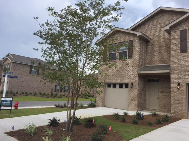 Beautiful brand new townhome at Reserve Pointe in Navarre, Florida. This 3BR/2.5BA townhome has a definite ''wow'' factor. From the moment you enter, you'll be amazed with the craftsmanship and decadent touches found throughout the space. This includes granite counter tops in the kitchen and bathrooms, stainless steel appliances, beautiful fixtures and flooring. Downstairs you will find the main living areas and a conveniently placed half bath. The bedrooms have been placed upstairs for additional privacy. The backyard area offers a nice patio area that is perfect for summer barbecues and cookouts. Reserve Pointe is one of Navarre's newest communities and comes with a range of amenities for residents. This includes a playground, community pool, picnic tables and deck space. Lawn care is included in the rent. This rental is pet friendly with approval and deposit.