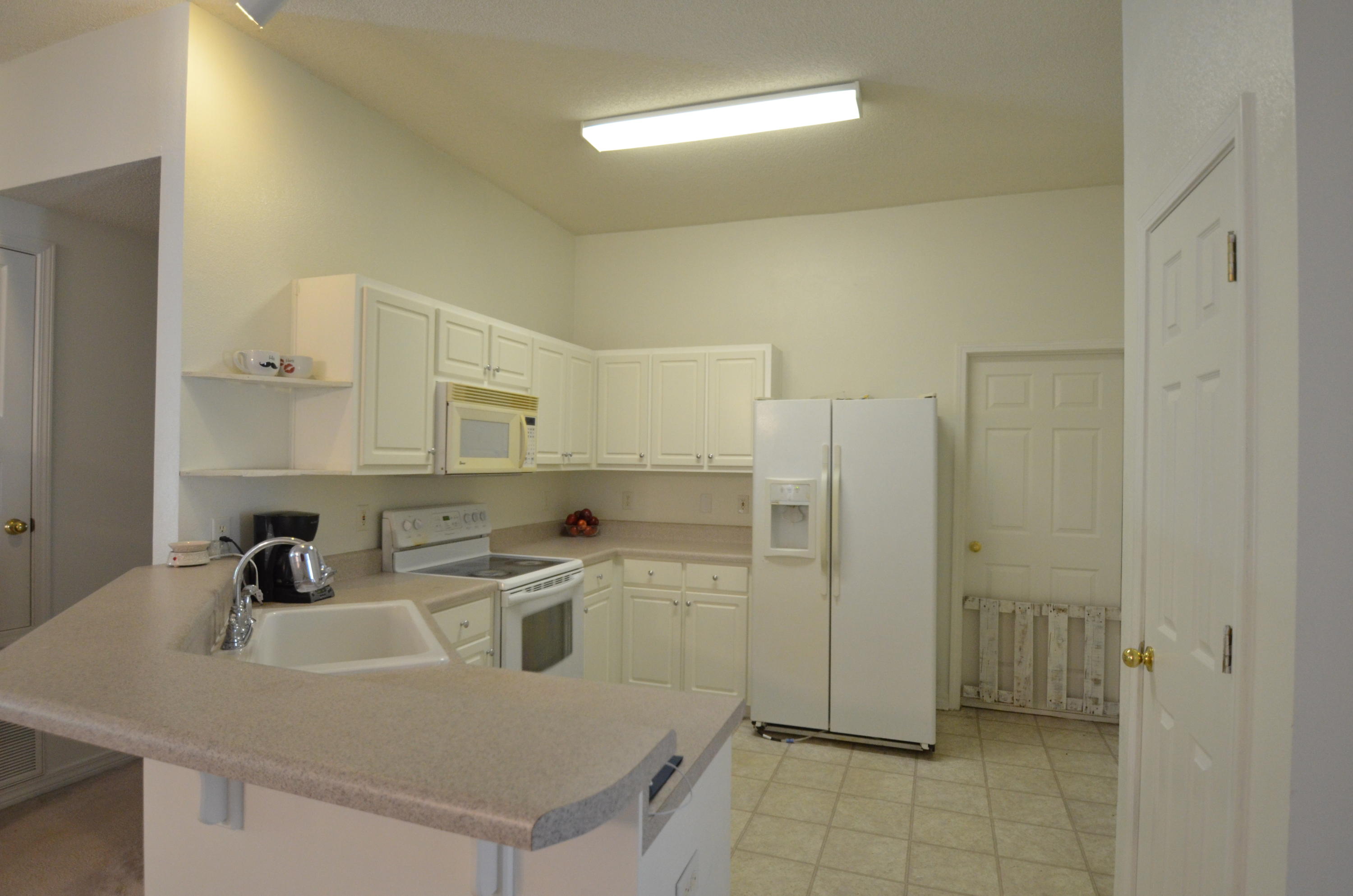 This home is in a waterfront community with underground utilities that has been well-designed with palm trees and tropical plants. Undisturbed nature areas and water views add to the beauty of this subdivision. A short walk on the community boardwalk allows you access to the beach on Santa Rosa Sound and DEEDED water access. The floor-plan is open and functional with an inside laundry room. The kitchen has lots of cabinets, a pantry and built in microwave. There is also an elevated breakfast bar that opens to the living room and dining room! The master bedroom has a large walk-in closet and is spacious. The master bath has double vanities. The back yard is partly fenced and has a hot tub that does convey as-is (it does work). There is also a lawn pump and sprinkler system.