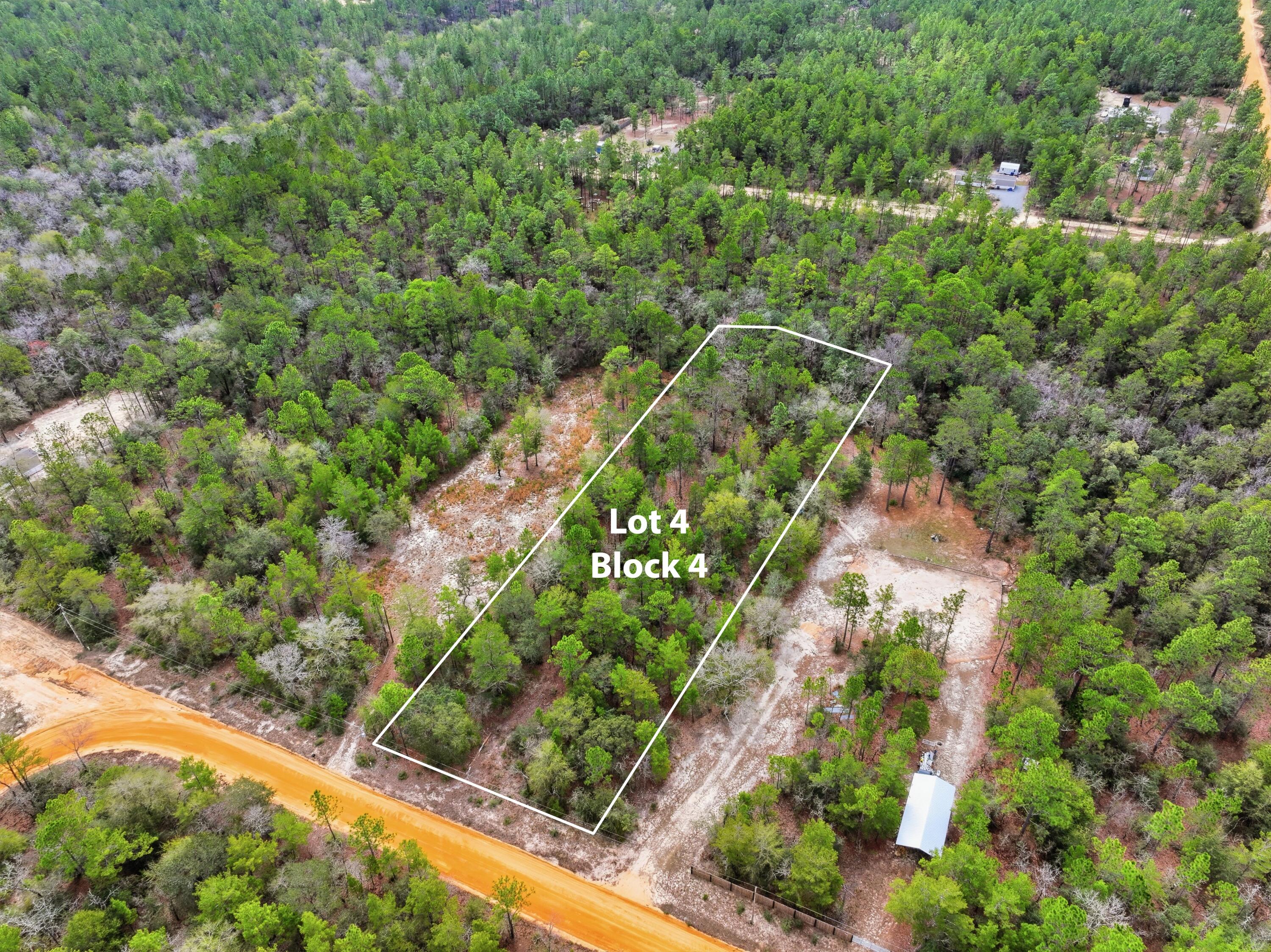 Beautiful 1.09 acre parcel located off Squire Way in DeFuniak Springs, Florida. The property features gently rolling terrain with a small creek running through the southern portion, creating a scenic natural setting while still leaving plenty of usable space for a homesite.

This lot offers privacy and natural character while still being conveniently located just minutes from downtown DeFuniak Springs, shopping, and restaurants.

This lot would be perfect for a new mobile home or site built home. Power and cable at lot line.