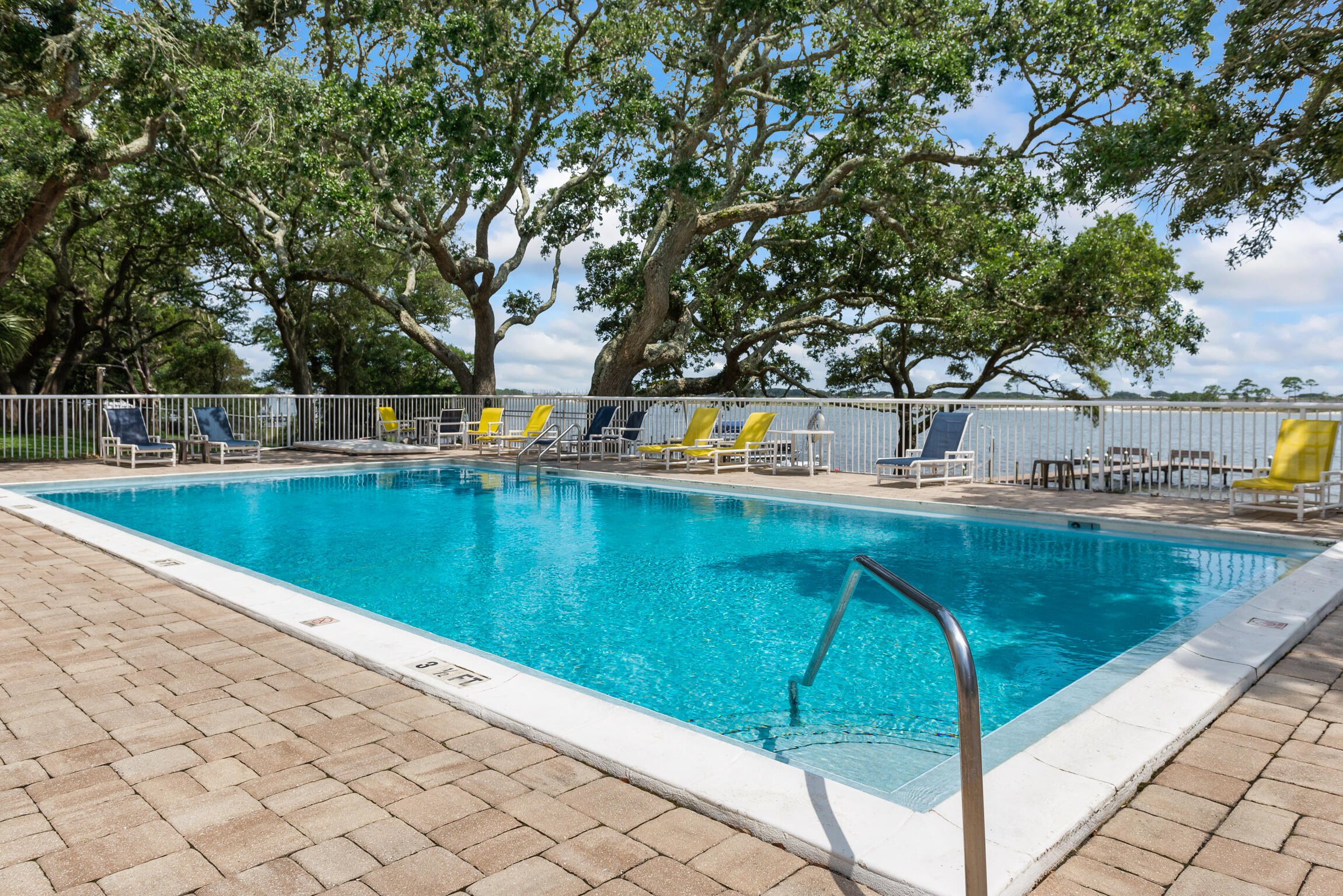 Enjoy waterfront living in this charming 1 bed/1 bath condo in the Cedars. This condominium complex comes with a long list of amenities including a perfectly shaded 8ft pool overlooking the Santa Rosa Sound, a community dock for fishing or sitting while you take in the breathtaking views, a kayak rack to store your kayak free of charge, a pool house for hosting parties and a fully stocked laundry facility. This first-floor is spacious unit with a nice sized master bedroom, balcony with extra storage and galley kitchen. The association takes care of the exterior insurance, maintenance and upkeep, pest control, and water/sewer and trash. Fully Furnished