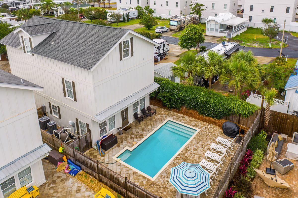 Completed in January 2018 and boasting a projected $140,000+ in gross annual rental revenue, 47 Sundance Court is an ideal vacation rental property. Upon walking in the front door, you are greeted with soaring 10' ceilings and a spacious open floor plan that provides a functional and carefully designed layout. The main floor is generous in space and flows seamlessly between the well appointed kitchen complete with a large island and additional sitting, living room, dining area and opens up to the pool area. The first floor has a spacious master suite with a walk-in closet, dual vanities and a walk-in shower. The egress to the pool and backyard provides an easy transition from indoor living to outdoor relaxation and the backyard boasts a large private pool surrounded by lush foliage, new pool furniture and ample privacy. 

This home functions very well as both a family home and a vacation rental property, as it was designed with care and attention and that shows in the details of the home. The entire property is finished with gorgeous hardwood flooring throughout, and the second and third floor bedrooms are thoughtfully designed to have king-sized beds, en-suite bathrooms and large closets. Additionally, the cobble-stone pavers surrounding the pool and making up the driveway provide an extra layer of elegance along with the soaring ceilings, tons of natural light and impeccable crown molding throughout.  

47 Sundance Court is centrally located near world-class shopping, dining, and entertainment such as the Destin Commons, Sandestin Outlets, and Grand Boulevard. This home also has a low HOA fee of only $500 annually and is only a short walk from public beach access.
