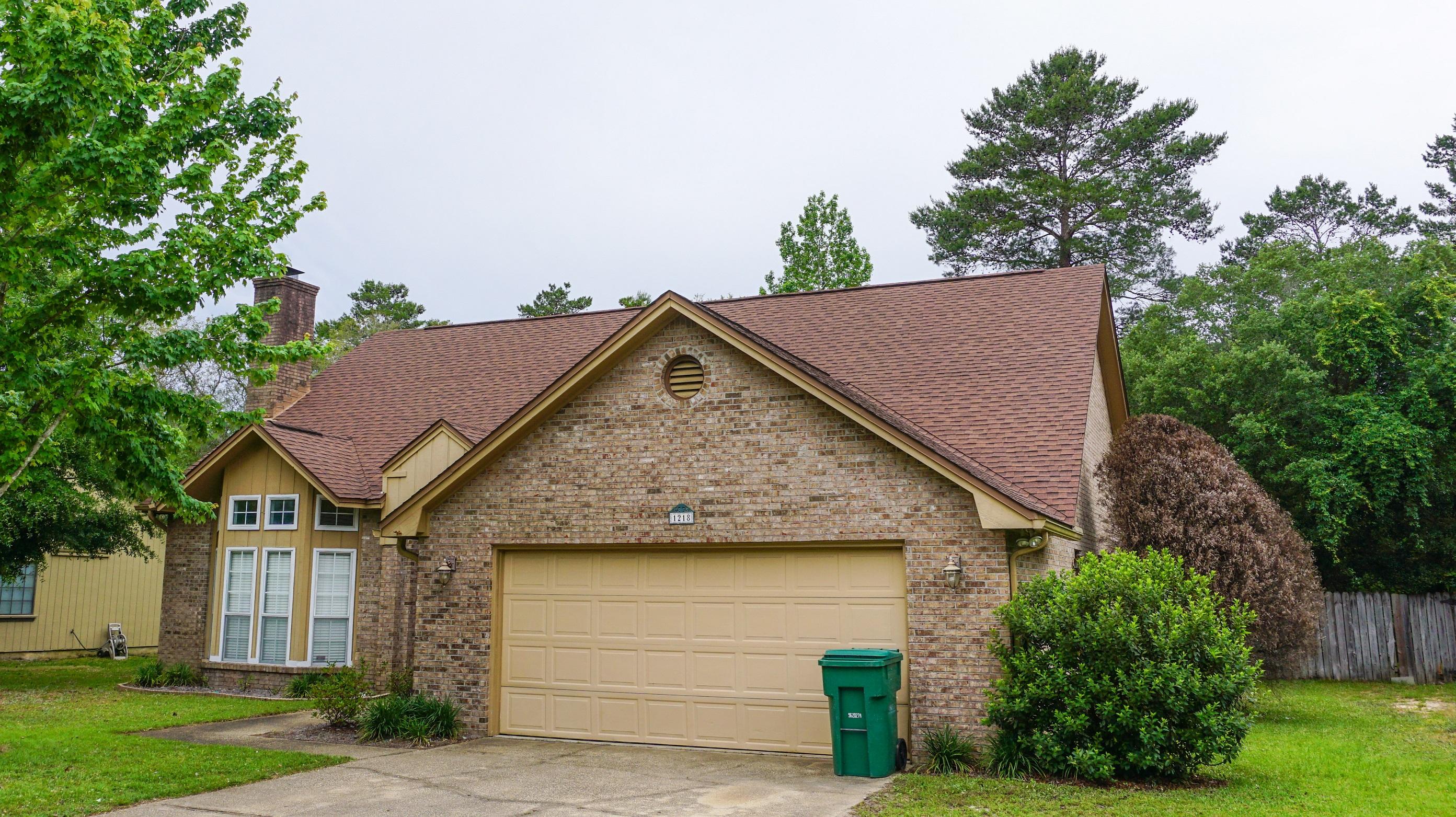 Available Now. Pet Friendly. Beautiful well maintained home nestled in the Woodlands S/D. Just minutes from Range Rd, Eglin AFB, shopping, dining, and the world's most beautiful sugar white beaches. Plush landscaping and colorful gardens provide eye catching curb appeal. Open floor plan with tons of natural light along with 10' ceilings, tile flooring with custom tile borders, crown molding, modern lighting and fixtures. Great room has natural wood burning fireplace and is open to the dining area, which then flows right in to another living space. Kitchen features tile floors, dishwasher, refrigerator, smooth top stove and lovely plant ledges. the large eat in kitchen area nestled next to a large bay window which overlooks your spacious back yard. The master bedroom sports cathedra ceilings, and master bath provides his and her vanities, jacuzzi tub, and a tiled separate shower. No smoking in home.