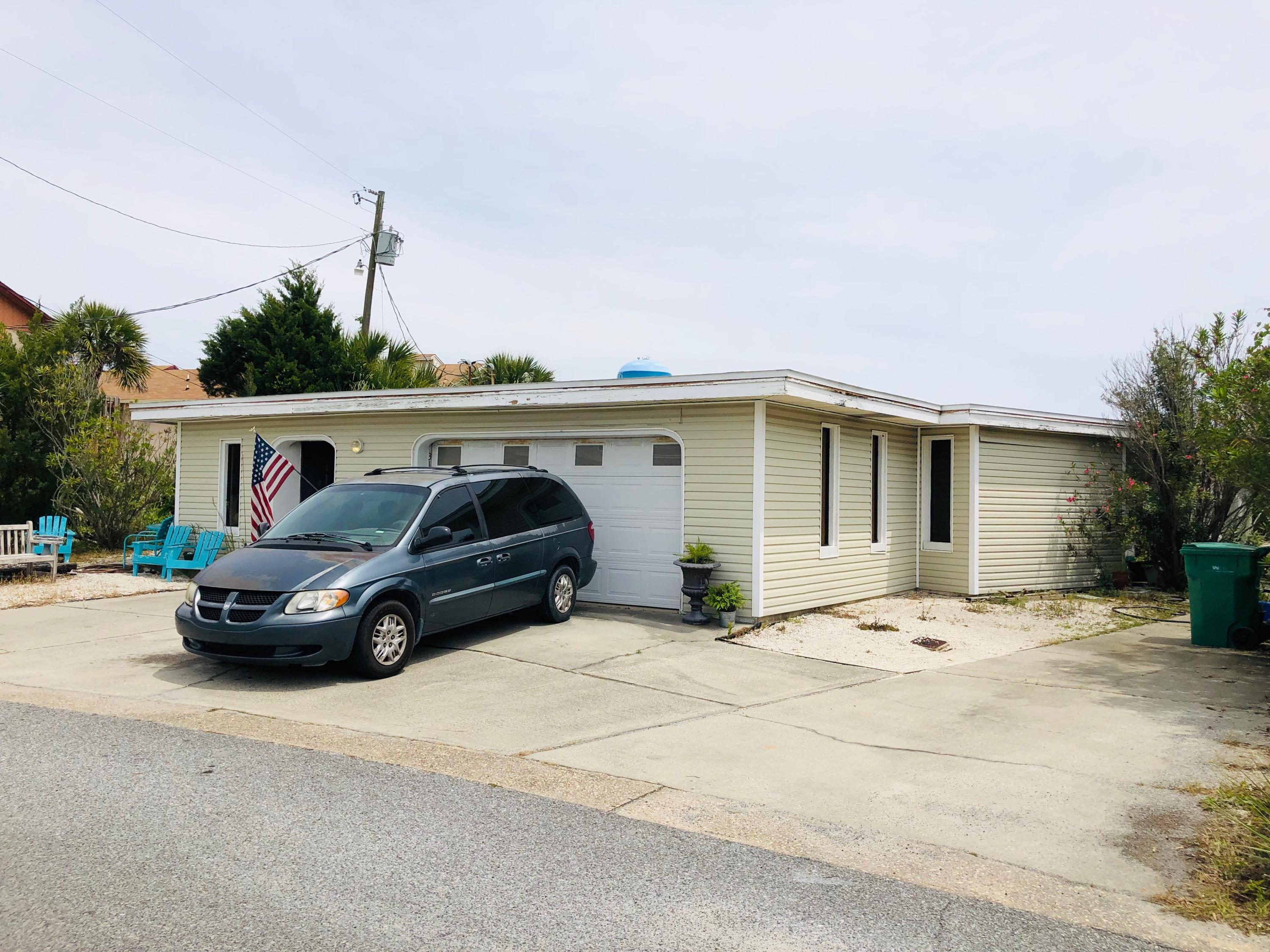 Investors Dream! This duplex has incredible potential as a vacation rental with some updating and renovation due to its proximity to the Beach! This Lot has a BOARDWALK on the back side of the Lot that stretches all the way to Santa Rosa Blvd and is directly across from a PUBLIC BEACH ACCESS! This prime piece of land can have a Development Order approved up to 12 Units (DO in MLS Documents has expired but can be approved according to the County Office), Don't miss your chance, CALL NOW!