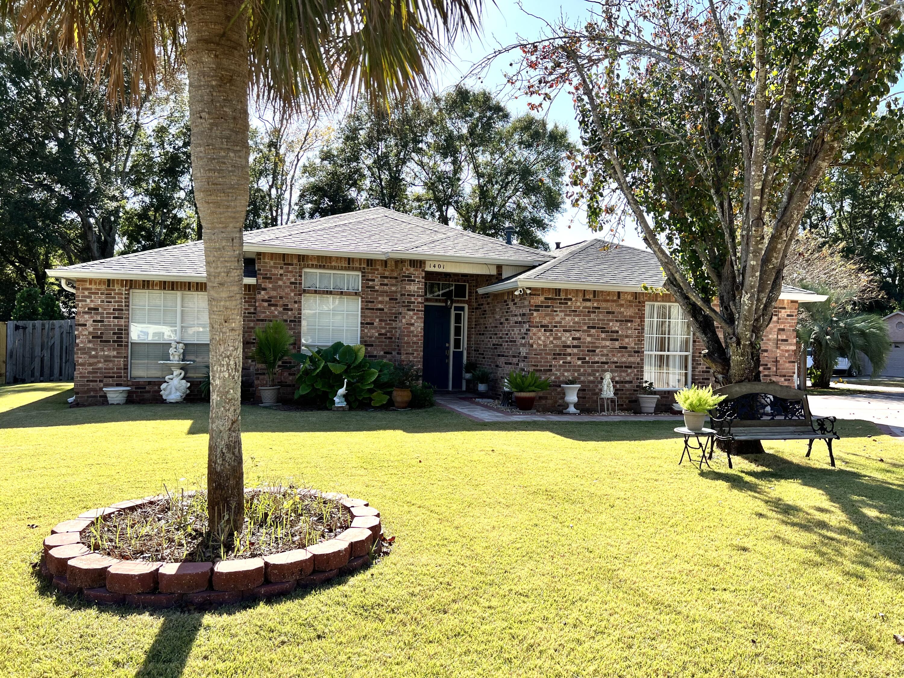 Exceptional home in the desirable neighborhood of Magnolia Plantation. Located in a gated community on a quiet cul-de-sac. This lovingly maintained home is only minutes from Eglin AFB, the Emerald Coast Beaches, Shopping & A+ Schools. It is also less than 5 minutes from community amenities: marina, tennis center, pool, and golf. 
High-ceilinged spacious four-bedroom two bath split floor plan offers something for everyone! Lots of natural light bathe the formal living and dining area. Off the formal living room are three bedrooms and a full guest bathroom. The king-sized master suite offers peace and quiet after a long day. Master bathroom features a double vanity sink, large walk-in closet, jetted tub, and a separate stand-up shower.
Grand family room / open kitchen combination is