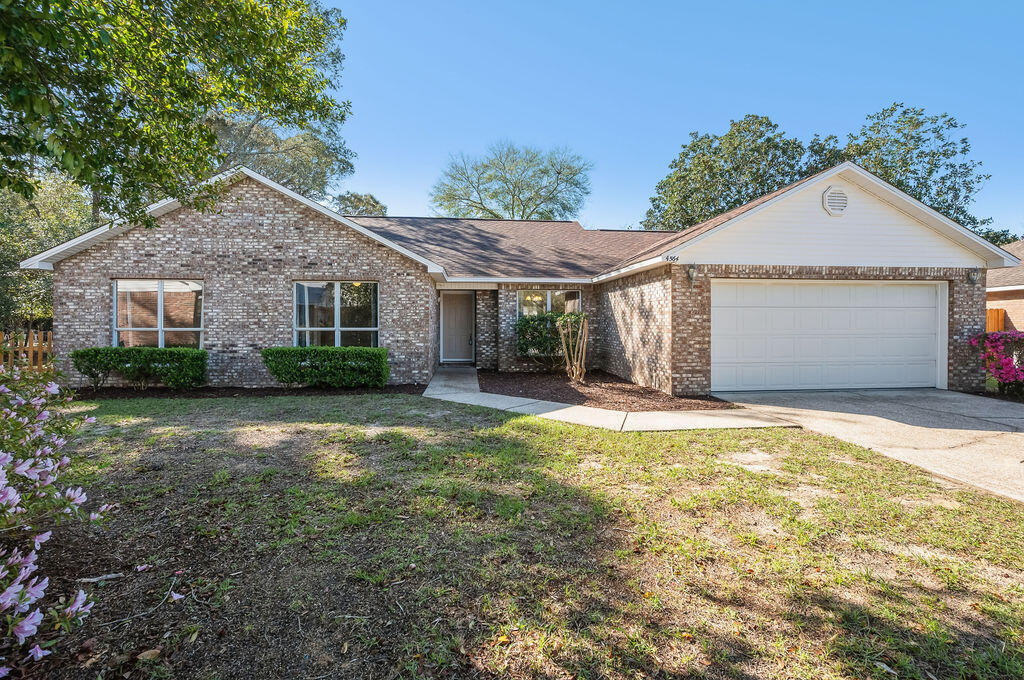 Tucked away at the end of a quiet cul-de-sac in the gated community of Parkwood Estates, this beautifully refreshed home blends privacy, space, and thoughtful modern updates.  Situated on one of the largest and most desirable lots in the neighborhood, the property backs to mature trees and is adjacent to Eglin Reservation, creating a peaceful, natural backdrop rarely found in Bluewater Bay.  Inside, the home has been thoughtfully refreshed with a bright, clean, modern aesthetic.  New vinyl plank flooring flows throughout, complemented by freshly painted interiors and ceilings, new updated baseboards, modernized electrical outlets and switch plates, and all-new window screens. The kitchen features professionally refinished cabinetry, stainless steel appliances, gas stove, bright breakfast nook with built-in desk and new French doors leading to the backyard, filling the space with natural light and offering an updated, energy-efficient design. Both bathrooms have been beautifully renovated. The spacious Master features 2 closets and offers a new vanity, new fixtures, and new shower with glass door.  The secondary bath offers a new vanity, new tub, and updated fixtures for a cohesive move-in-ready feel. Designed for comfortable living, the home includes 4 generously sized bedrooms including a 17x15 Master bedroom, two full baths, a spacious great room with gas-log fireplace, vaulted ceilings, a separate dining room, and an oversized utility room with cabinetry and workspace.  For added peace of mind, major systems have been addressed: Roof (2020), Water Heater (2019), and brand new HVAC (2025). Step outside to a tranquil patio and fenced backyard where mature trees frame the setting, creating privacy and a true sense of retreat. Walking distance to  Bluewater Bay Elementary School, this home is ideally located within the gated community of Parkwood Estates.  Enjoy convenient access to Eglin AFB, Duke Field, and Hurlbert Field, with Destin's beautiful beaches, dining, and shopping just a short drive away.  This is an exceptional opportunity in one of Niceville's most desirable gated communities.