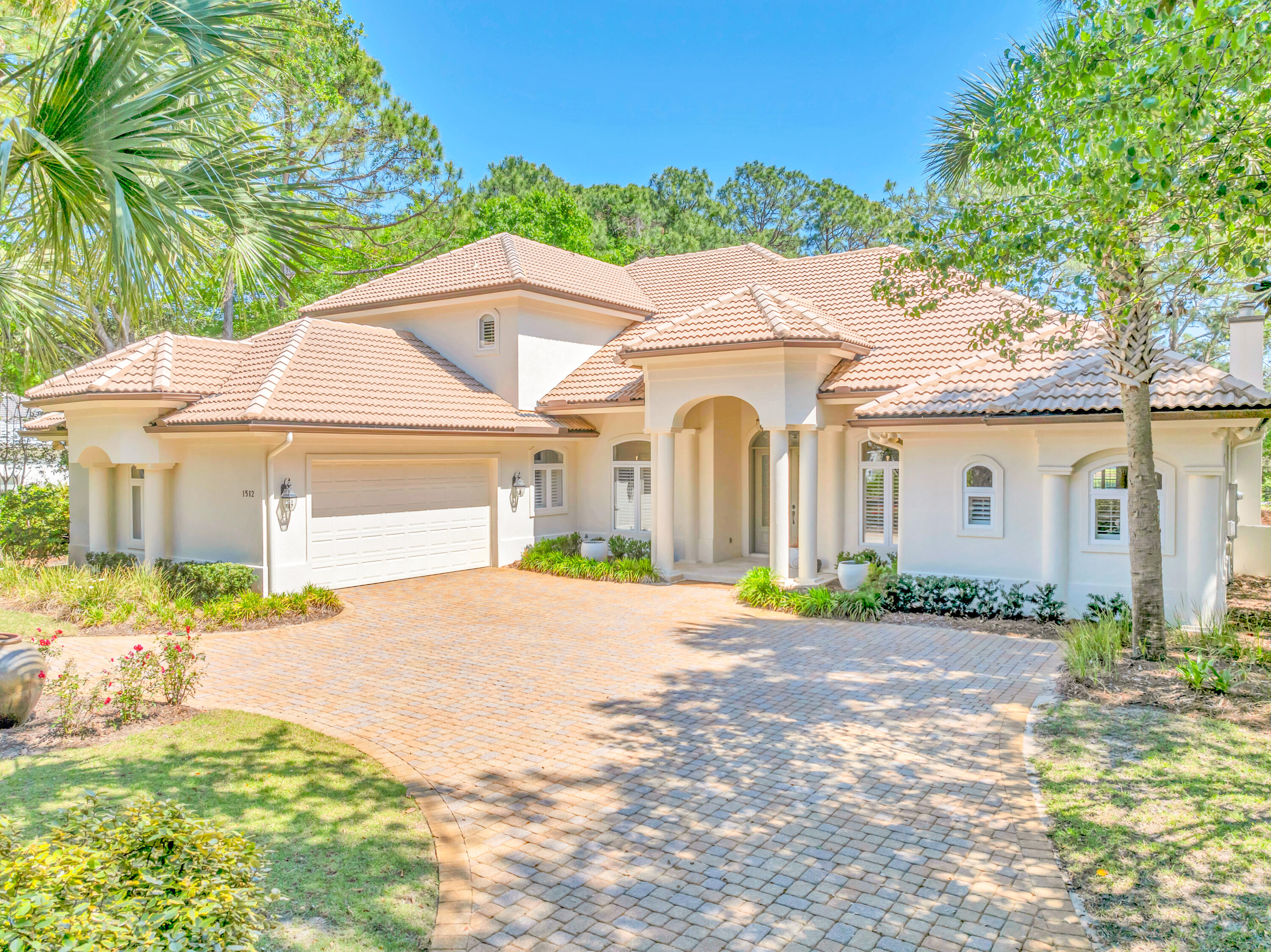 Elegantly reimagined with high-end finishes and expansive indoor-outdoor living, this exquisite Island Green residence offers a rare opportunity within one of Sandestin Golf and Beach Resort's most exclusive enclaves. Poised on a quiet cul-de-sac with sweeping views of the Raven Golf Course and a tranquil lake beyond, the home captures a sense of privacy and refinement at every turn.

The stately interior features wood and limestone flooring, soaring 20-foot ceilings, and an abundance of natural light from walls of glass that frame the lush fairway backdrop. The designer kitchen is a chef's dream with quartz countertops, 48-in. Sub-Zero paneled refrigerator, Miele gas cooktop, apron-front sink, and custom tilework. A spacious living room with a fireplace flows into the formal dining area, breakfast nook, and a cozy family room with a wet bar, making entertaining both effortless and elegant.

The first-floor primary suite serves as a private retreat with a fireplace, sitting area, dual walk-in closets, and a spa-worthy bath wrapped in limestone and glass tile. A dedicated office, an additional guest suite, and an oversized laundry room complete the main level. Upstairs, two bedrooms and a loft-style lounge provide space and flexibility for guests or multigenerational living.

Outdoors, a retractable screened lanai opens to the beautifully landscaped backyard with a grill, waterfall hot tub, and pool. Additional highlights include a three-car garage, golf cart garage door, and recent upgrades to A/C systems and landscaping. Tucked inside a gated community with access to Sandestin's premier resort amenitiesgolf, tennis, biking paths, marina, and morethis refined estate is the pinnacle of resort living.
