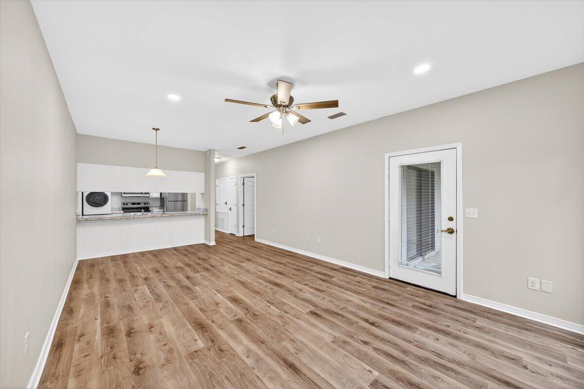 **Available Now!!** **small pet considered with owner approval**


****Utilities are included with an additional $200 monthly fee. Utility Fee covers: water, sewer, garbage, electric, pest control, and landscaping services..****

Move-in ready 1 bedroom, 1 bath home featuring a bright, open living area with beautiful LVP floors and sliding glass doors that lead to your private balcony or patio. The pass-through kitchen offers wood cabinetry, neutral counters, and appliances that include a refrigerator, stove, microwave, dishwasher, with a convenient in-unit stackable washer/dryer!

The spacious bedroom features a ceiling fan and generous closet space, while the bath boasts an extended dual-sink vanity and a full tub/shower combo