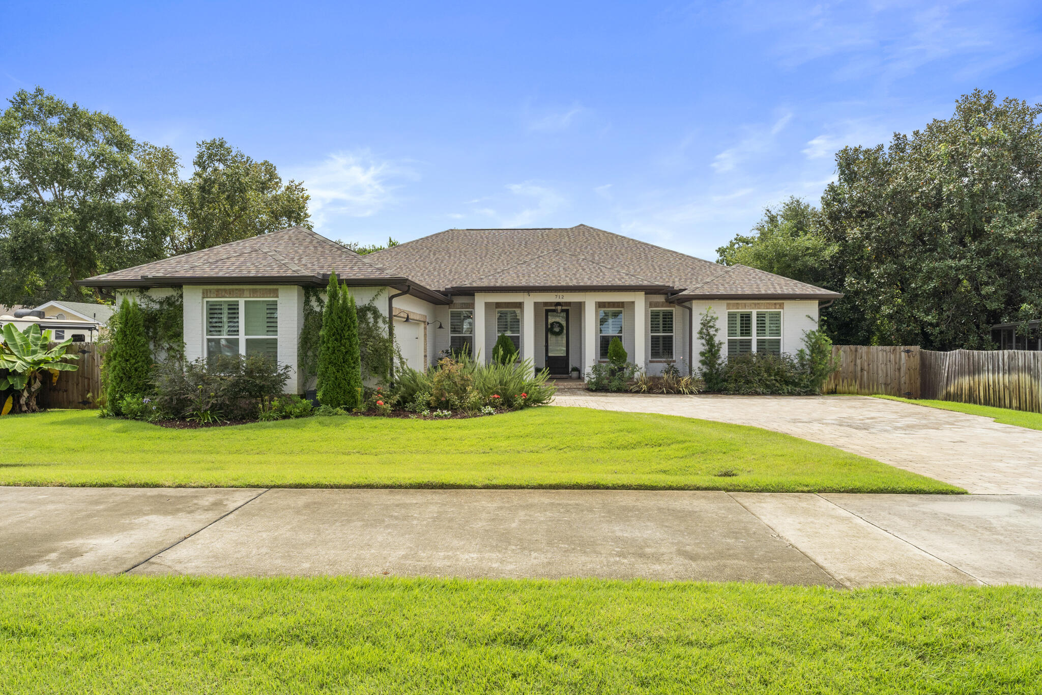 Beautiful better than new custom built home contains approximately 2,506+-SF featuring 4 bedrooms, 3 baths, plus a formal dining room and a formal study with a side entry 2 car garage and covered lanai. Built in 2019. This home features custom finishes, moldings, and fixtures throughout. Gourmet Chef kitchen features Quartz counters, large island, gas range, full doors separate commercial style Fridgedaire fridge and freezer.  Kitchenaide dishwasher. Lots of extra custom cabinets. Single bowl sink. Microwave nook. KItchen has eat in area and a dining room. Too many upgrades to name them all in this home. LVP and tile flooring throughout with carpet only in bedrooms. Open floor plan. Living room features electric fireplace with temperature control and custom built in bookcases. Ceilings are 10 feet and all doors are 8 feet. Office with doors for privacy. Luxurious master bedroom suite and bath. Spacious shower, soaker tub, and his & her closets. Custom closet systems added too! Custom paint colors throughout. Plantation shutters and woven wood shades do convey. Covered Lanai overlooks nicely landscaped yard. Large paver patio, Pergola, and fire pit create the outdoor dining and entertaining space! Privacy fenced too. New shed stays with the home. Alexa controlled smart lighting.This home is located in downtown west Destin within close proximity to Harborwalk, Joe's Bayou boat launch and all the recreational activities and festivities that Destin has to offer. Walk to Destin Elementary. Termite Bond with HomeTeam Pest Defense. Make 712 Kelly Street your next home!
