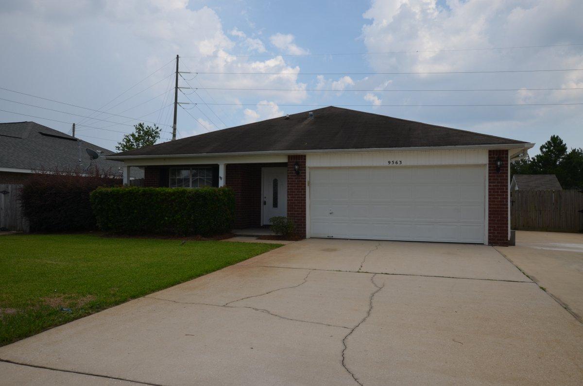 Move in Ready REO home with lots of space for the family! Located in the heart of Navarre and just minutes from the beaches, shopping, schools and bases, this 4 bedroom 2 bath home is just what the doctor ordered. Brick front with vinyl siding, the back yard is privacy fenced and the front has extra parking for boat, trailer or those jets skis. Home was recently rehabbed by the bank and comes with new granite tops in the kitchen, new stainless steel appliances, new laminate, carpet and fixtures throughout. A definite must see if looking for a larger affordable home in Navarre!