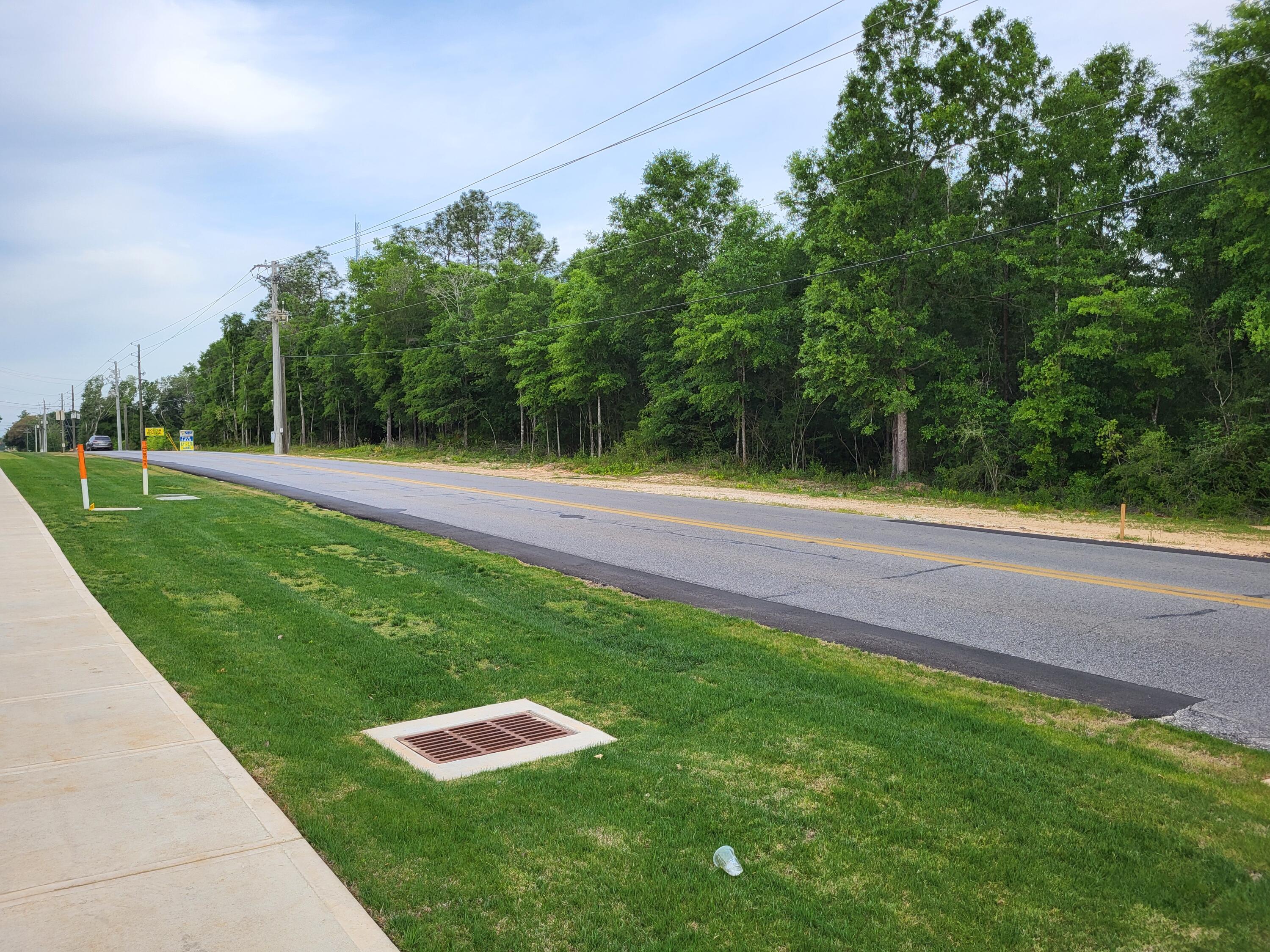 Price Reduced over $80,000 motivated seller. 6.8 acres zoned C-1 Commercial in the City of Crestview, 350 feet of paved road frontage, property slopes to the rear, all wooded.  Located near the Hospital, Walmart, and Interstate 10.  Eglin Air Force Base, Duke Field, and the Army Special Forces are large employers in the area. Population of 48,453 within 5 miles.