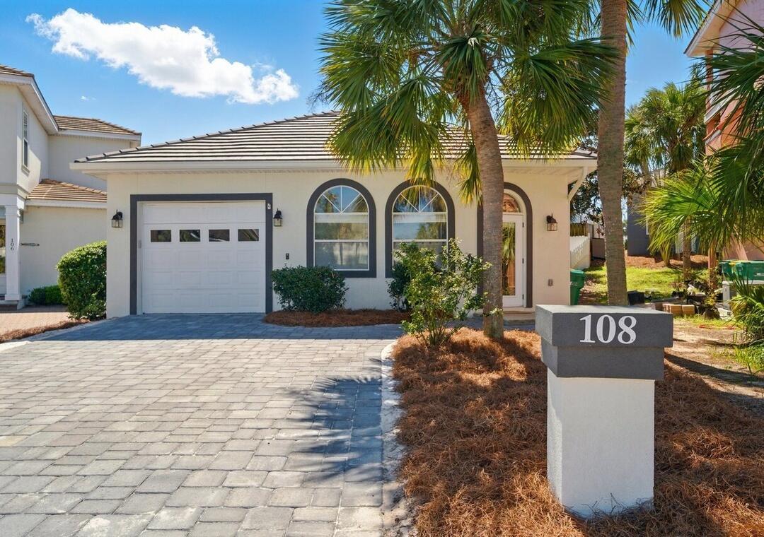 Breathtaking Coastal Luxury Just Steps from the Sand!
Welcome to 108 Terra Cotta Way, an exquisite, fully remodeled beach house w. garage offering the perfect blend of refined elegance, resort-style living, and exceptional investment potential. Nestled within the exclusive Terra Cotta Terrace community, this captivating home features deeded, gated beach access, a private heated pool, and a garage, all designed for effortless coastal living.

From the moment you arrive, you'll be drawn to the home's fresh exterior paint, updated landscaping, and tranquil surroundings. Inside, soaring ceilings and an open layout create a bright, airy atmosphere flooded with natural light. Every detail has been thoughtfully curated, showcasing new flooring, designer lighting,and modern touches throughout! The chef's kitchen is a true showpiece, featuring storybook white custom cabinetry, endless quartzite countertops, and new stainless steel appliances - perfect for entertaining or quiet evenings at home. Bathrooms have been beautifully updated with new cabinets, mirrors, lighting, and spa-like finishes, offering a serene and refined experience.

This spacious sanctuary boasts two luxurious master suites, ideal for hosting family, friends, or vacation guests. Step outside to your private oasis, where the re-surfaced Marcite pool, privacy wall, and lush setting create a tranquil resort-style escape - perfect for relaxing after a day at the beach.

This home shines as both a full-time residence or income-producing coastal investment. With low HOA fees, residents enjoy access to exceptional community amenities including a community pool, tennis and pickleball courts, sand volleyball, BBQ grills, and a clubhouse for gatherings and events. 

One of Terra Cotta Terrace's most appreciated features is its quiet, non-cut-through streets, offering a peaceful, exclusive neighborhood ideal for morning walks, bike rides, and a true sense of serenity. The private gated beach access is just steps away -perfectly positioned between The Crab Trap and Pompano Joe's on Scenic Gulf Drive.

Ideally located near beachfront dining, boutique shopping, championship golf, world-class fishing, Destin Commons, and Silver Sands Premium Outlets, this property offers a rare combination of luxury, location, and lifestyle.

More than a home, 108 Terra Cotta Way is a coastal retreat, private haven, and unforgettable destination - where memories are made and guests never want to leave.