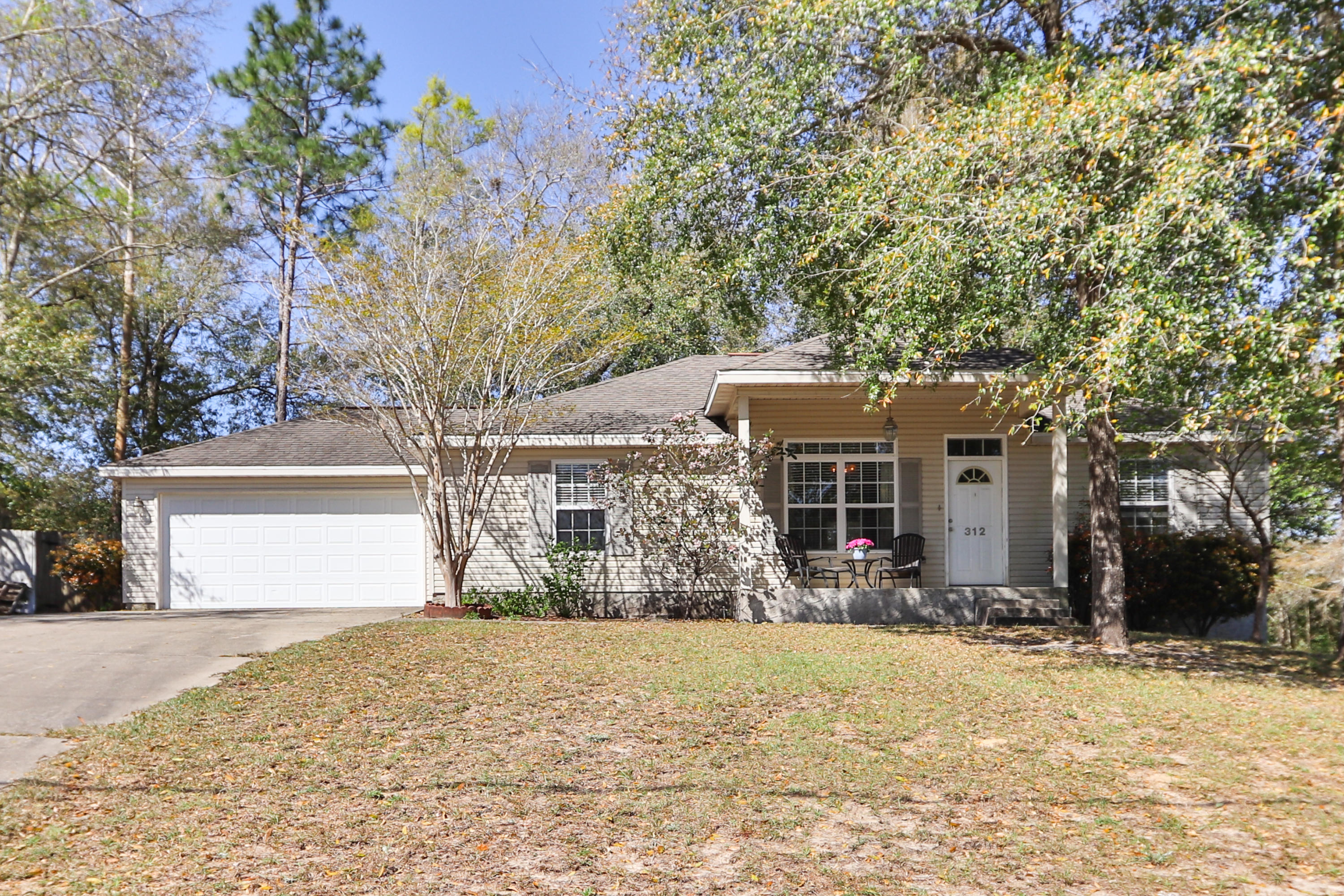 Multiple Offers. Please submit highest & best. Located in central Crestview in Winding Creek Estates. This well maintained and renovated 3 BR and 2 BA home with 2 car garage. Dimensional shingle roof. New Trane AC in 2018 with Smart Thermostat. Split bedroom design offers lots of privacy. Master bedroom has trey ceiling. Master bath has garden tub and shower combo,new toilet, new light fixture, large walk-in closet plus a separate linen closet. New LVP Asheville Pine Wood style flooring in most of the home. 5 inch baseboards in living room. New ceiling fans. Crown molding. Kitchen has been renovated with freshly painted white cabinets, new Samsung stainless appliance package, white subway tiles, new faucet, knobs and handles. Custom grey freshly painted living areas. Pex plumbing syst with Manabloc panel in garage. New blinds. New light fixtures. Renovated guest bath with new light fixture, mirror and painted vanity. Lots of natural light. Beautiful trees in the front and back yard, this home has plenty of curb appeal and added charm. Front lawn is equipped with a sprinkler system. Large deck overlooks the large fenced back yard. Vinyl siding offers low maintenance on this one. Don't let this one pass you by, so take a look today!