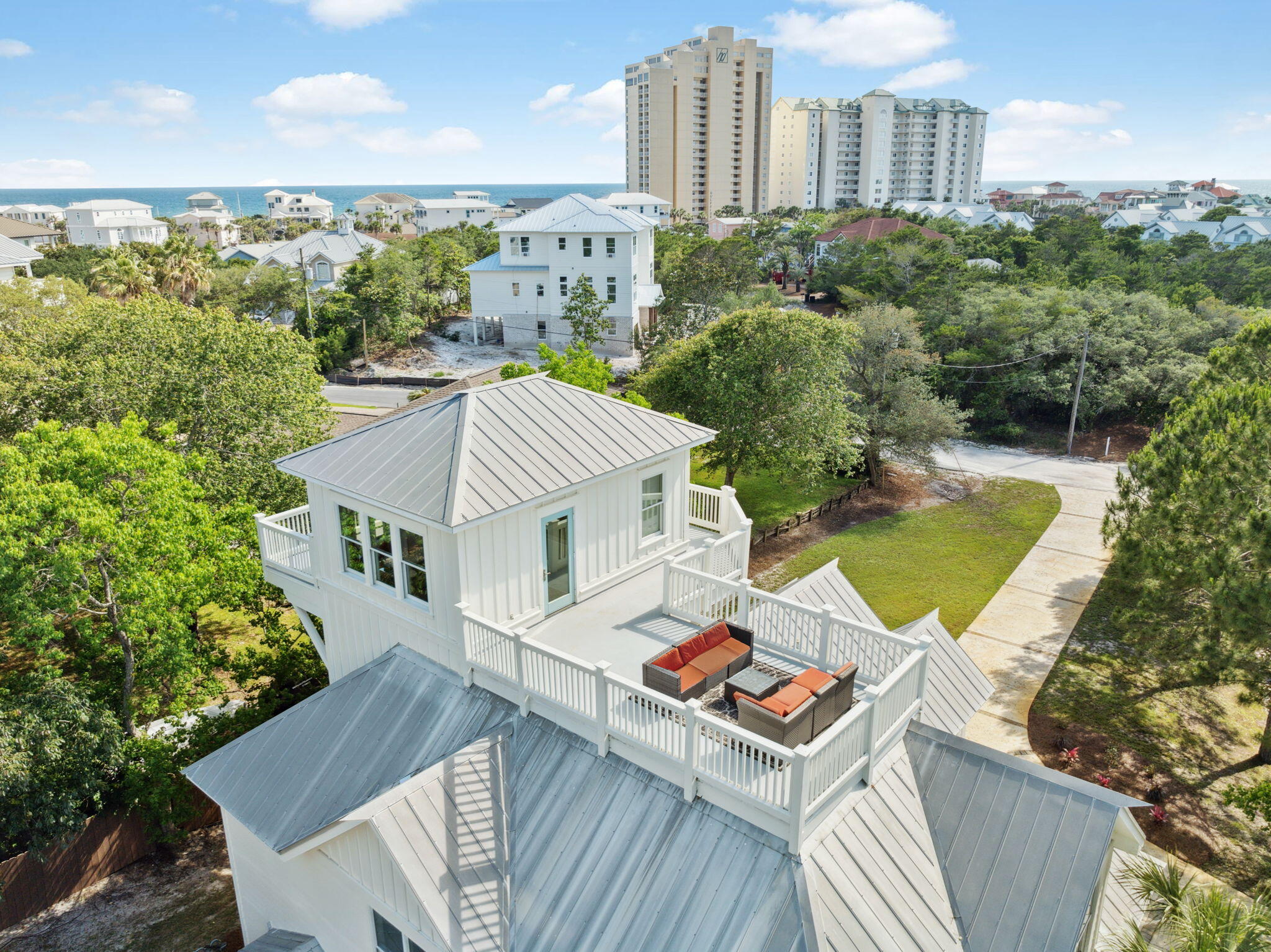 Tucked away in Miramar Beach, Gulf Pines is one of Walton County's best-kept secrets—a coveted, low-density neighborhood where all homesites are a minimum of 1/2 acre, offering an unparalleled blend of privacy, natural beauty, and convenience. With over 1,400 feet of private, deeded beach access just a short walk from your doorstep, this serene coastal enclave offers a truly relaxed, uncrowded beach experience, ideal for a primary owner or lucrative vacation rental. Set on over half an acre and surrounded by mature, lush grounds, this beautiful five-bedroom retreat complete with a private pool with sun shelf perfectly captures the charm and comfort of life on the Emerald Coast. Inside, the open-concept layout offers a spacious living area that flows seamlessly into the dining space and a beautifully appointed kitchen with custom cabinetry, marble countertops, stainless steel appliances, and a generous island bar. A mudroom and guest bedroom on the first level provide added functionality and flexibility. The home has received several recent upgrades including a fresh interior paint and a newly refinished pool deck with paverscreating an ideal setting for outdoor entertaining or peaceful afternoons in the sun.

The second level features duel primary suites, both with private balcony access. The main primary bedroom boasts a luxurious ensuite bath with duel vanities, walk-in shower and jacuzzi tub. Also located on the second level is a fun, coastal-inspired bunk roomperfect for younger guests or extra sleeping space.

Ascend to the third level to discover a loft-style bonus room complete with a wet bar and ice makeran ideal setup for entertaining, relaxing, or even working remotely. This versatile space could serve as a media room, game room, or a quiet home office retreat.

Just beyond, the shipwatch offers a peaceful perch with southwestern exposure, where you can enjoy glimpses of the Gulf over a mature canopy of pine trees and take in vibrant sunset vistas from the spacious sundeckperfect for unwinding, sunbathing, or hosting golden-hour gatherings.

In addition to the nearby beach access, this home enjoys a prime central locationjust a one-minute drive to the area's top shopping and dining destinations. Explore over 110 designer and brand-name factory stores at Silver Sands Premium Outlets or enjoy the upscale retail, restaurants, and events at Grand Boulevard. You'll also be just moments from the vibrant atmosphere of Baytowne Wharf in Sandestin, known for its family-friendly entertainment, waterfront dining, and nightlife.

This is a rare opportunity to enjoy the best of coastal livingquiet, private, and naturally beautiful, yet only minutes from everything you love about South Walton.