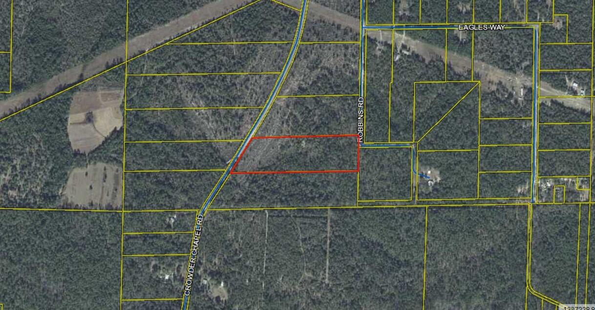 Beautifully treed lot on 12 acres, great place to build your dream home.  The Sellers have power and water run to the street.  There is also a cleared area on the property.