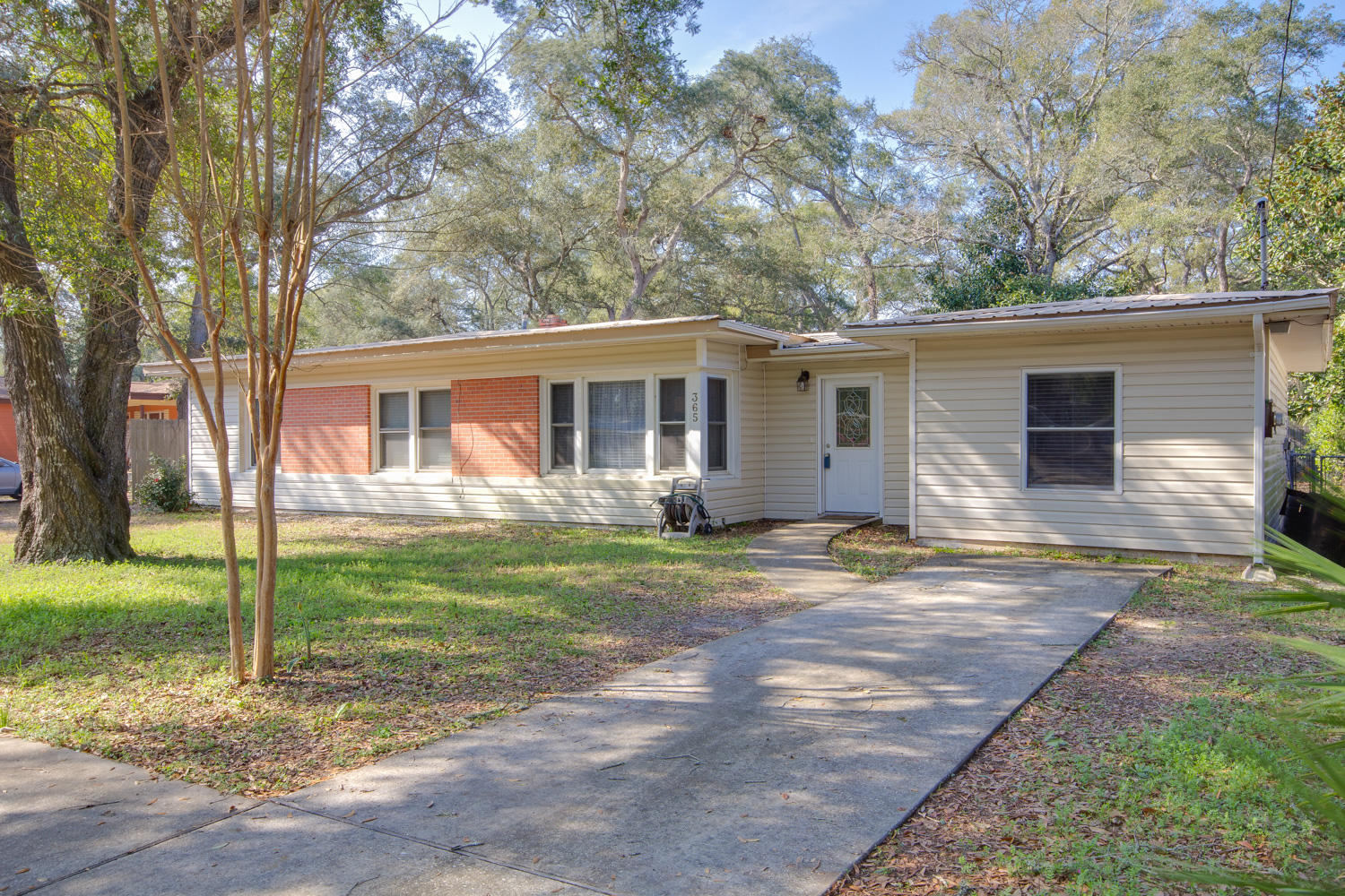 Completely remodeled 4 Bedroom, 2 Bath home with bamboo flooring and 2 master suites on a large lot near water access in highly desired Elliott Point subdivision. Just 1 block from the Bay. Large yard building all housed in a privacy fenced back yard. 3 ton A/C & heat and hot water heater all replaced in the last couple of years. Metal roof too! Easy maintenance vinyl siding with brick accents. As you enter the main foyer, you do indeed know you're in for a special treat. Put this home on the short list of homes to see. Call us today for your private showing!