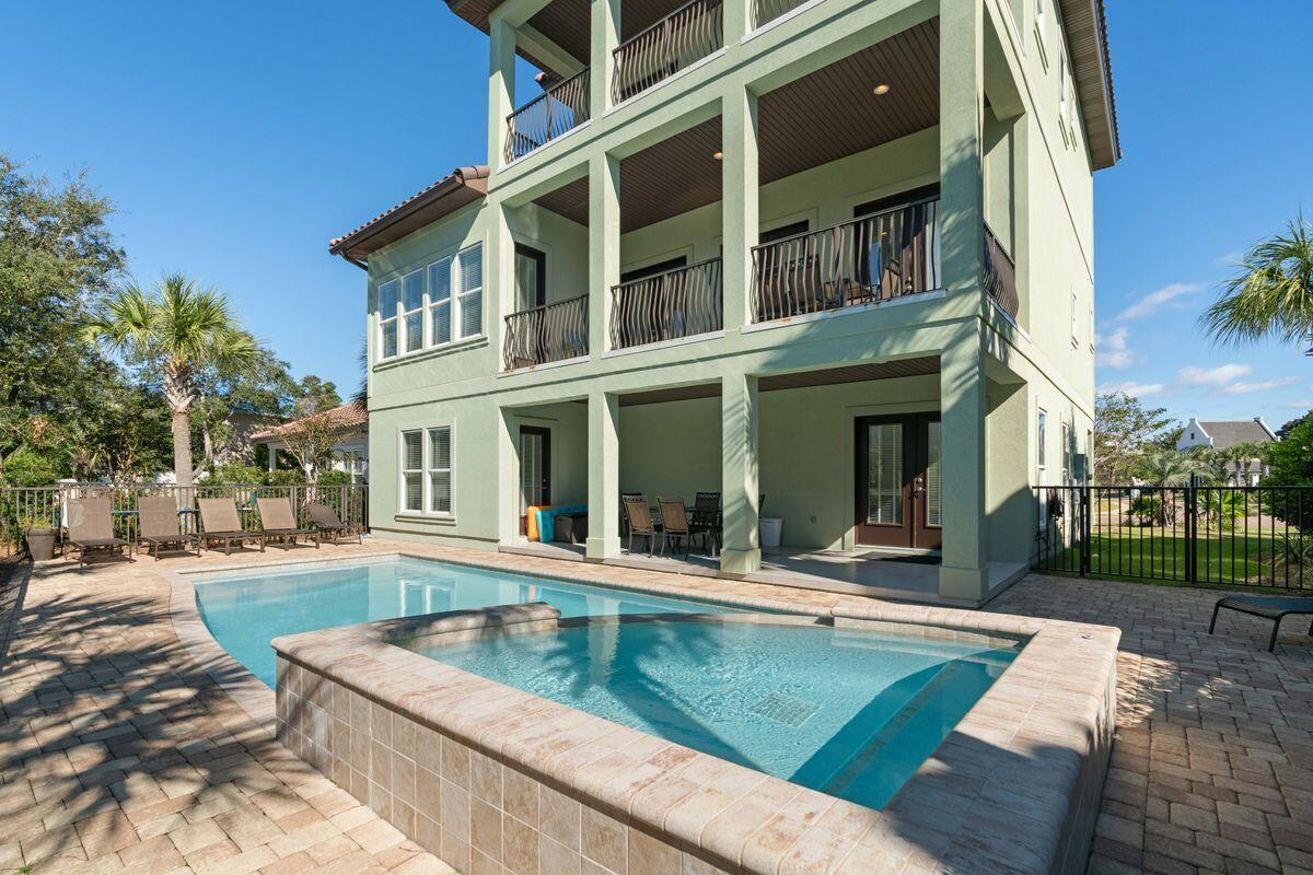 Ideally situated in the exclusive gated community of Destiny East, ''Destiny Dreams'' is one of only five homes in the community with deeded beach access in close proximity. This five-bed, five-and-a-half-bath retreat built in 2016 is a remarkable beach home that offers gulf views, a private pool with waterfall, and an elevator. Spread over more than 3,700 square feet of living space and boasting over $177,000 in gross rental history YTD 2021, this three-story build features multiple living areas, multiple owner's suites on the first and third floors, and a spacious outdoor oasis for relaxing or entertaining. Built with a reverse home plan that places the main living and kitchen areas on the second floor, this floor also offers access to a generous balcony with sparkling gulf views. The home's first floor includes easy access to the pool with both covered patio and pool deck seating and gas grill, as well as a bunk room and two-car garage. The third floor is occupied by a living area, reading nook and large covered balcony with gulf views. Notable finishes in the home include hardwood flooring throughout, granite countertops and a large kitchen island and pantry. Updated coastal decor and furnishings bring the beach indoors. Home to both full-time residents and second home owners, Destiny East offers some of the best community amenities available on the Emerald Coast, including two neighborhood pools, a hot tub, fitness center, community room, movie theater, tennis and basketball courts, BBQ area, walking trails and playgrounds, all conveniently situated with nearby access to Emerald Coast Parkway and Scenic Highway 98.