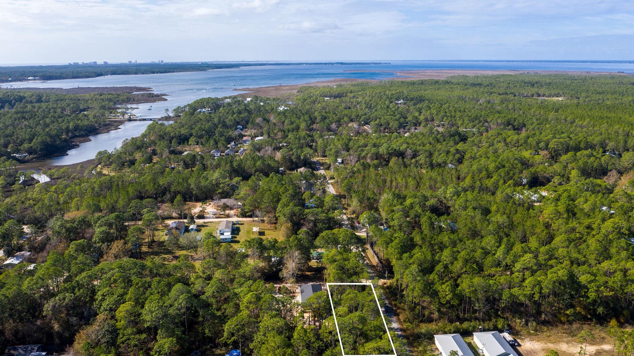 10K Price Improvement. This 50 x 125 wooded lot makes this a great investment opportunity to build a home to rent and or sell or use as a full time residence. Homes on this street have a solid tenant history. Located in a quiet area just off of Old Indian Woman road and close to Choctawhatchee Bay. Just over a mile to Cessna Landing with boat ramp, picnic tables and playground. This area puts you close to fishing, beaches, shopping and dining on 30A without the high prices. Call today!
Buyer should verify all data and dimensions.