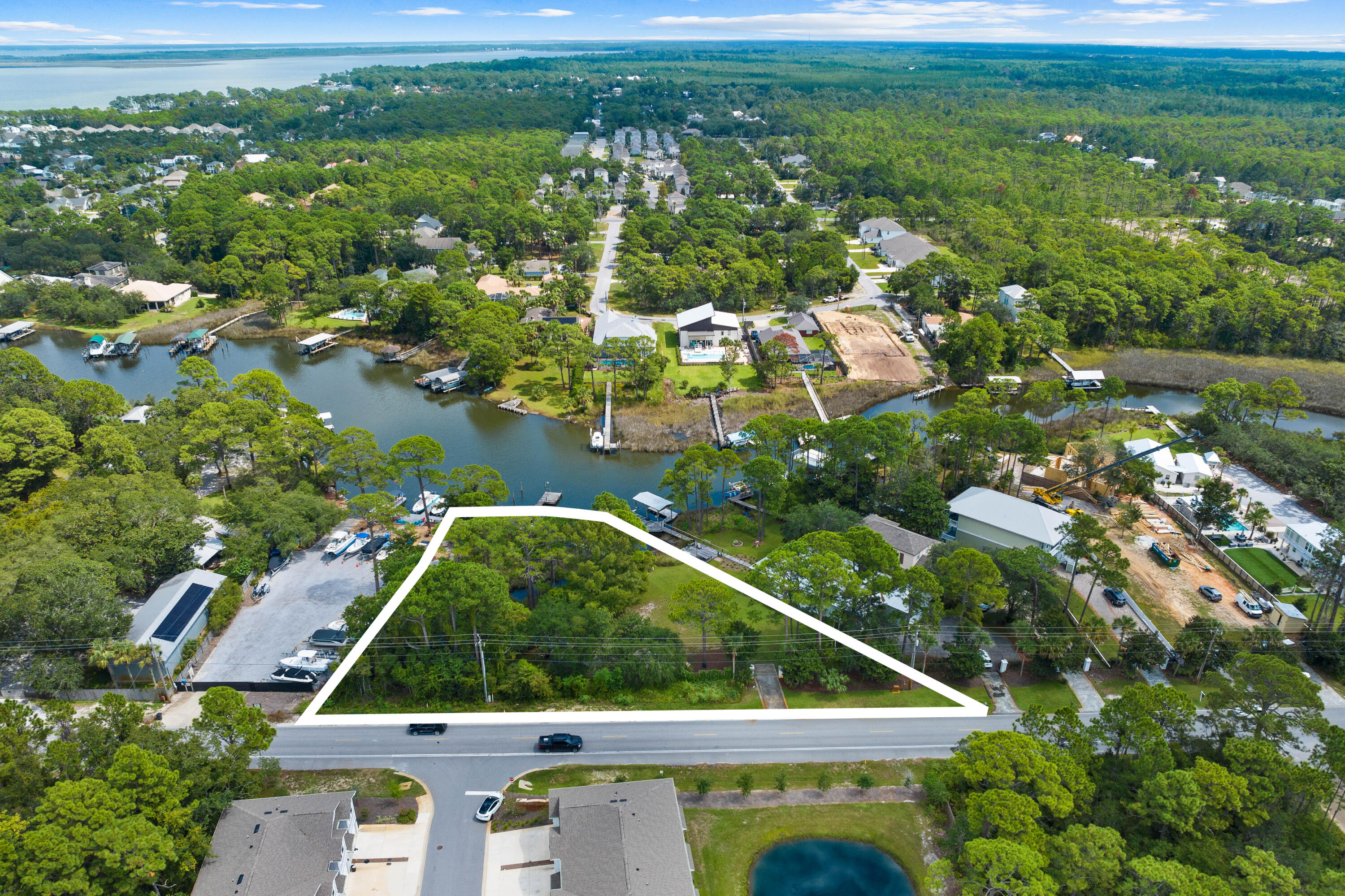 Situated in Bocage Bayou Estates, this residential lot with 6,881 square feet of buildable space offers a unique blend of accessibility and exclusivity. Gated and deed-restricted, the property ensures a level of privacy and security that's increasingly rare. What sets this lot apart is its deep-water access, complete with a 150' dock, making it an ideal choice for boating enthusiasts or anyone looking to embrace an outdoor lifestyle. Adding to its appeal is the presence of a freshwater well, dedicated solely to irrigation, ensuring that your landscaping ambitions can be as grand as your architectural ones. A 12' x 12' shed on the property provides convenient storage space, allowing you to keep boating or gardening equipment close at hand. This lot is strategically positioned in the vicinity of shopping centers, entertainment venues and a hospital, offering all the conveniences of modern living while retaining a sense of secluded tranquility. For those looking to build a new home that harmonizes with a love for the water, this lot presents a rare and compelling opportunity. With its combination of natural beauty, practical amenities, and unbeatable location, it's more than just a place to build a home it's a place to build a lifestyle.