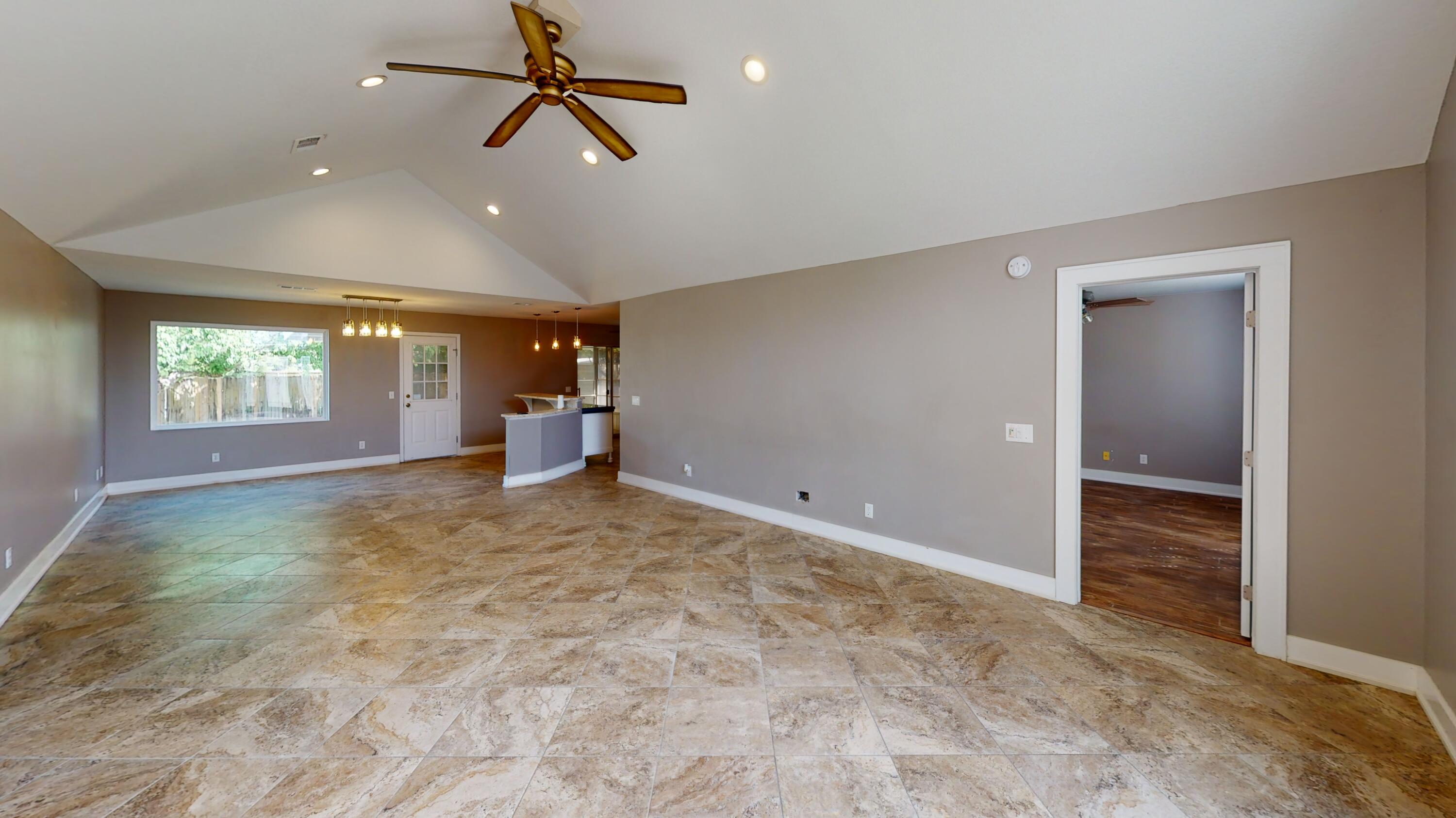 NOW ON THE MARKET!!! This 3 bedroom 2 bath home on a large corner lot in Holley by the Sea is waiting for you!  This welcoming home is situated in the Holley by the Sea subdivision in Navarre, just a short drive from Navarre Beach, shopping, and restaurants.  Enjoy the Holley by the Sea amenities such as multiple swimming pools, a well equipped gym and fitness center, boat launch, tennis courts, and so much more.  The roof was replaced in 2020 and both the hot water heater and HVAC have been replaced since 2016.  The home features newly remodeled bathrooms, a spacious living room with a vaulted ceiling, and a Florida room sitting next to a large concrete patio.  The large fenced backyard also has two storage sheds to give you plenty of storage.  Make your appointment today!