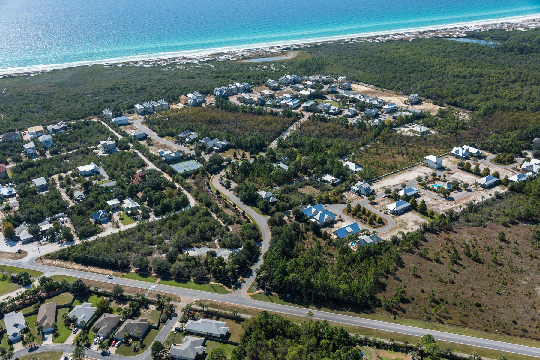 This lot backs up to preserve and is very near the board walk over the Cypress Head into Phase II; equally near both Phase I & Phase II Pools! This beautiful gated community shows nature at its best. Beautiful views of the gulf, the dunes and the state forest from the fabulous Life Style Center plus views of the lovely Cypress Head that is unique to this community! Infinity edge pool, fitness center, over sized hot tub, outdoor living area with fireplace and a viewing deck for those beautiful sun sets! Clay Tennis Courts and a second pool in Phase II, combined with custom construction by John Willis Homes and you have a real winner! See this lot today; Turtle Shuttle Service to beach from Memorial Day through Labor Day! Buyer should verify all information.