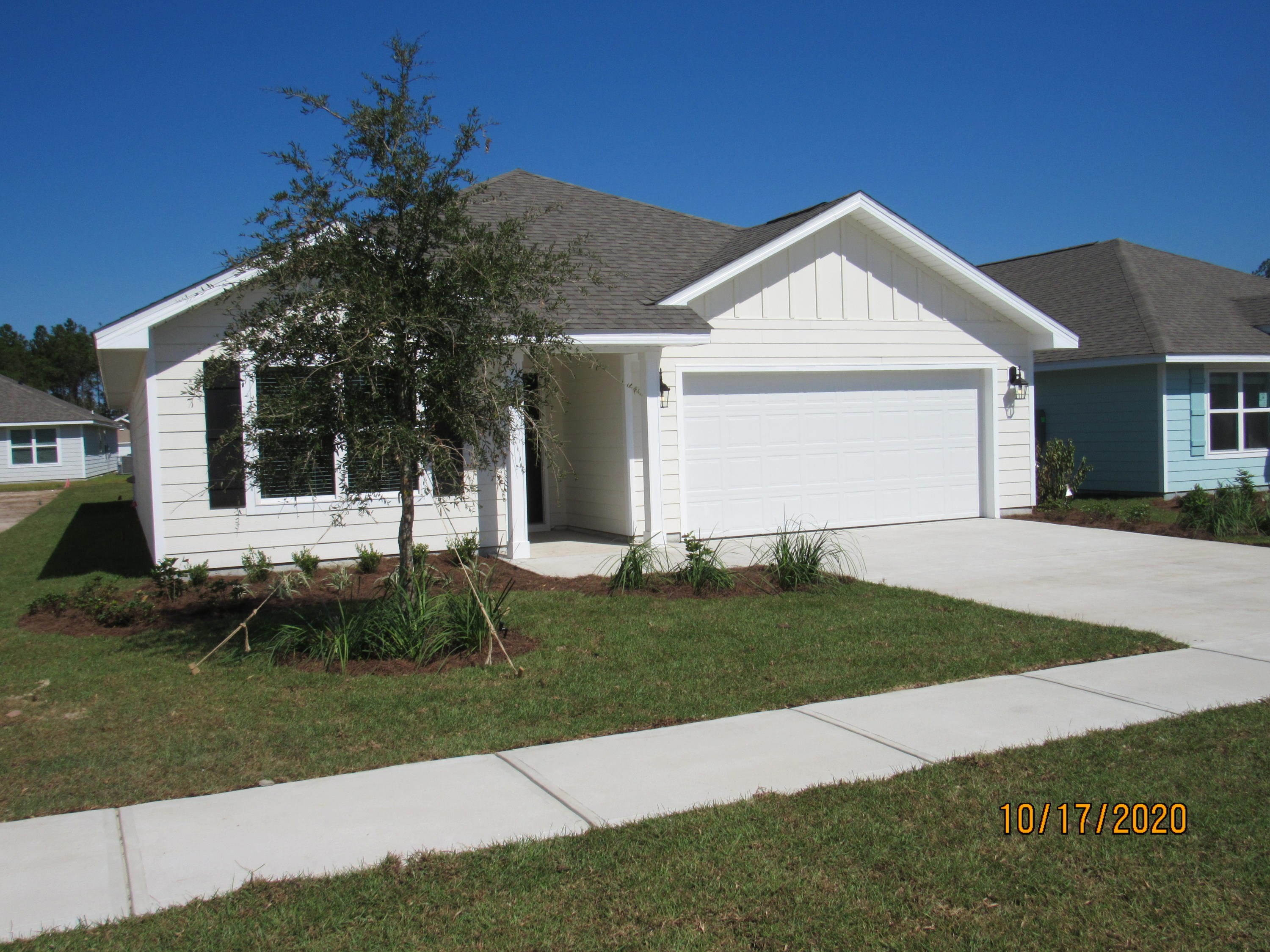 Just built in 2020! This gorgeous 3 bedroom, 2 bath home is nestled in a new community within the highly coveted Hammock Bay, which features innumerable, top-notch amenities, including but not limited to multiple resort-quality pools, dog park, walking trails, fitness center, club house, tennis & basketball courts, General Store, playgrounds, Bay-front pavilion and dock, RV/Boat storage (separate fee), & more! This lovely home boasts gorgeous flooring and neutral paint throughout and a split, open floorplan, complete with a spacious living room, formal dining area, and plenty of cabinet/counter space in the kitchen (complete with stainless appliances, including a flat cooktop stove & side-by-side refrigerator), island/ breakfast bar, and walk-in pantry. The master bedroom has its own en suite with a double vanity, walk-in shower, garden tub, and separate toilet room, as well as a walk-in closet. Both guest bedrooms are nicely sized and share a full bath, as well. There is a laundry room, and there is a covered patio overlooking the backyard. Pets may be considered with prior owner approval and a non-refundable pet fee. No smoking, including vapes.