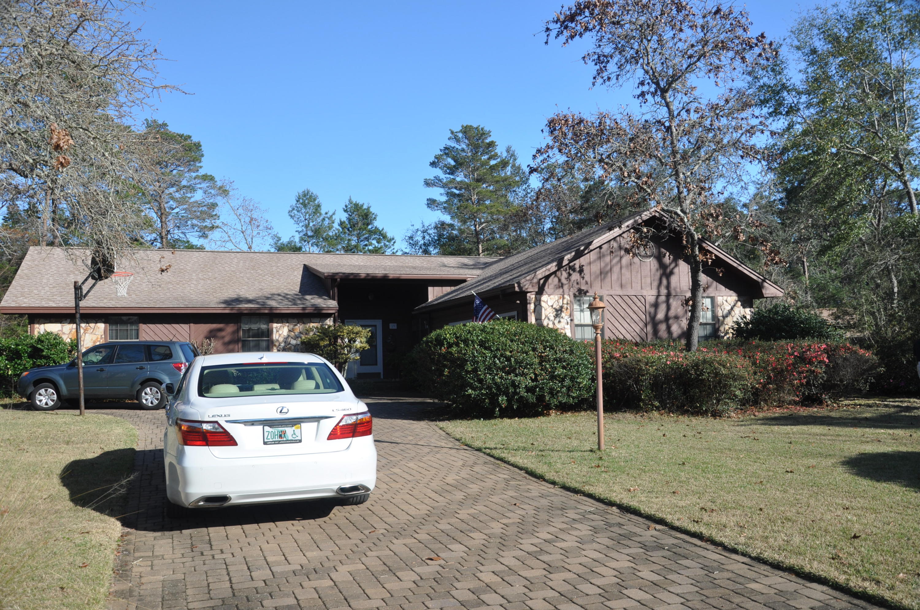 Very comfortable brick 4 bedroom, 2.5 bath family home in popular Bluewater Bay Raintree Estates. Well maintained home on quiet cul de sac. Pleasing front elevation with paver driveway and side entry garage. Kitchen features newer stainless steel appliances. Jennair down draft range, quartz counters and adjoining table. Kitchen is open to the great room. Bonus room for office or crafts. 315 square foot addition (heated and cooled) provides added use flexibility. Outdoor hot tub off master bedroom. Owners Association {non mandatory) maintains nature trail immediately behind the property - which leads to a very large playfield for softball or soccer. Association also maintains a common use park area at the Bay with covered pavilion, grills,and newly constructed dock on the lake side. Park area is close by off Southminister Court.  Property is within a short walking distance to the Whitepoint Recreation Area.  Close to shopping, churches, golf, tennis, swimming, and Eglin Air Force Base (the area's largest employer).  New 30 year roof in 2011.  Garage offers overhead storage.  Lawn pump for irrigation.  A must see property - a lot to offer.  Take a look today!!