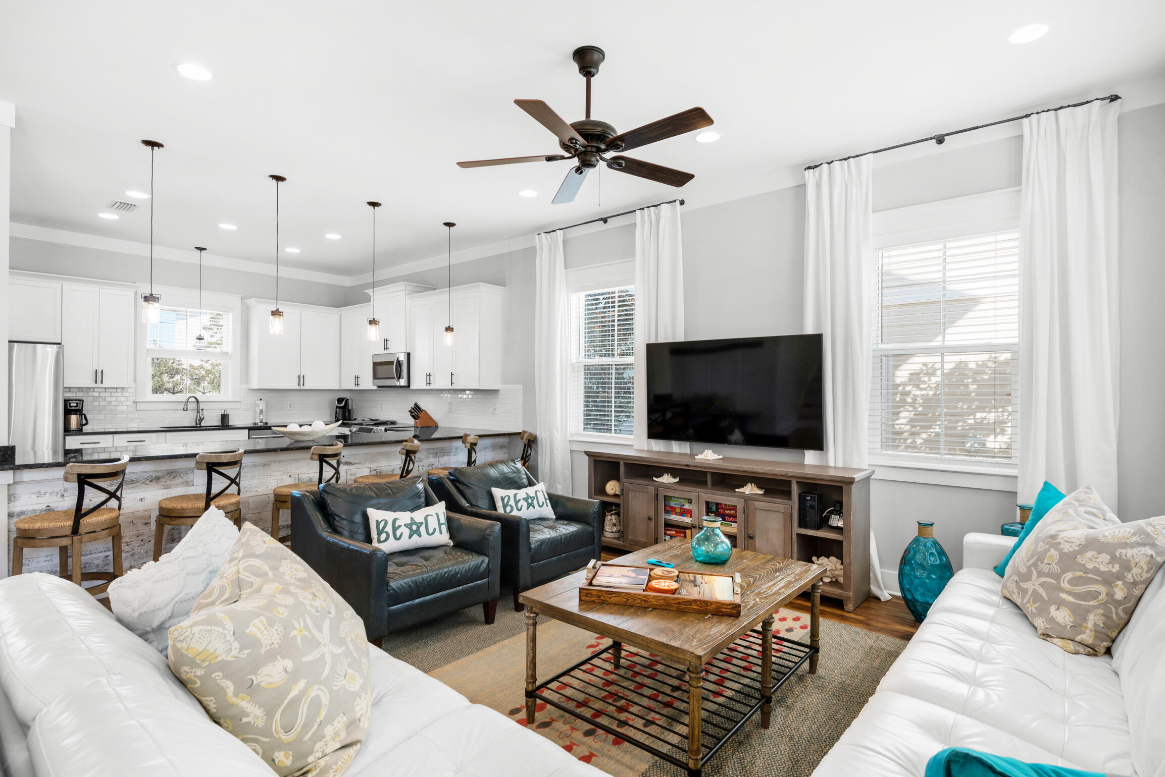 This exceptional Magnolia Dune home in Seagrove has it all! Built in 2015 and backing up to the community pool, this four bedroom (plus a bonus bunk room) home is the perfect spot for a 30A beach getaway. Park your vehicles in the large driveway and leave them there as 55 Sandalwood Drive is only a 0.2 mile walk away from the closest of two beach accesses as well as restaurants like 30A Cafe, Angelina's, and the Donut Hut. Upon entering the home guests will notice the large open floor plan layout of the kitchen, living, and dining areas. The dining table has seating for ten with additional seating for six at the large kitchen counter. The thoughtfully appointed furnishings in the living area make it a great place to unwind and relax after a long day at the beach while the chef's kitchen offers ample counter and storage space for the cook in your party. The first floor also features a laundry room with twin stacked washer/dryer units, owner's lockout closet (one on all three floors of the home), a half bathroom, and access off of the kitchen to the rear deck and outdoor dining area which is conveniently located adjacent to the beautiful community pool.

The master bedroom and two guest bedrooms are located on the second floor of the home. Each bedroom has its own ensuite bath and both the master and the eastern guest bedroom have direct access to the large shared second floor balcony. 

The third floor consists of the fourth bedroom with two twin over twin trundle beds and a bonus bunk area - both share the full bath via Jack and Jill access. The third floor balcony is a great place for morning coffee or an evening cocktail as one can catch a glimpse of the emerald green water of the Gulf of Mexico.

55 Sandalwood Drive is the ideal blend of comfort and convenience and a perfect choice for a second home or rental property located right in the heart of 30A in Seagrove.