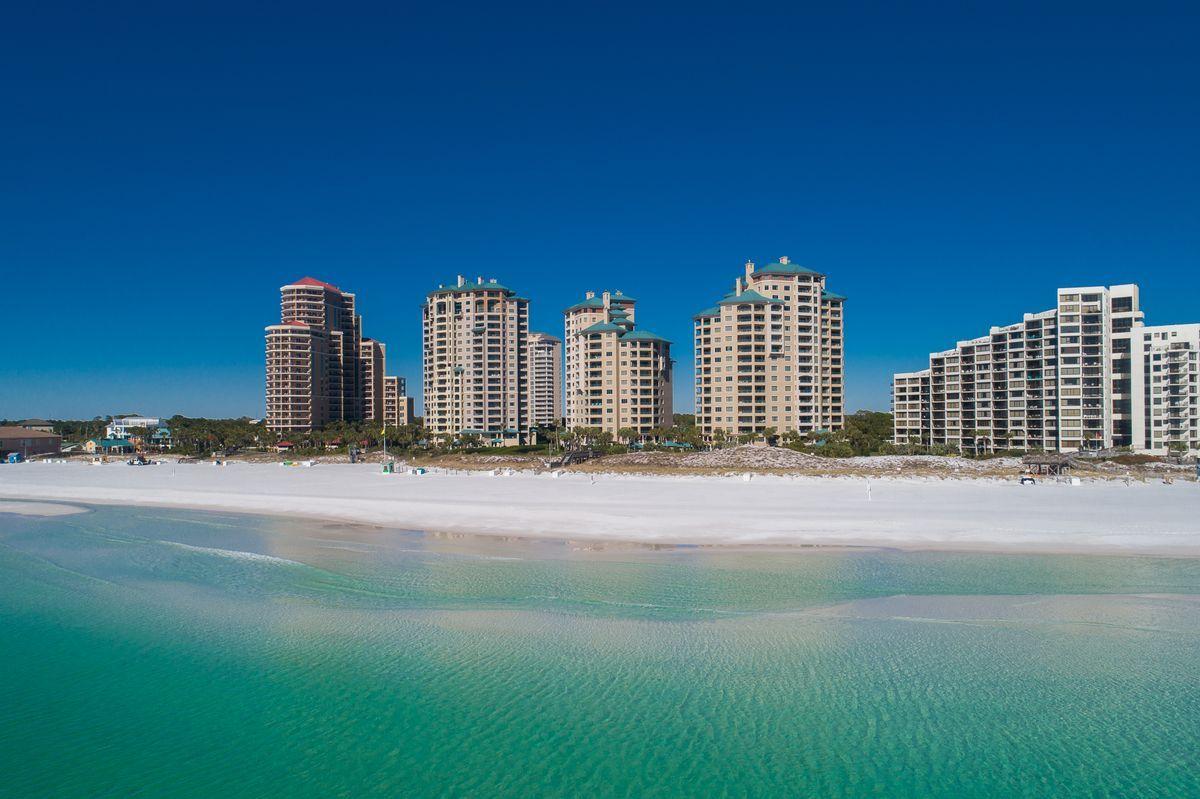 take a virtual tour through the photo link ! Escape into lavish Gulf front living at this spacious four bedroom beach retreat, located within the heavily amenitized Sandestin Golf & Beach Resort. Situated atop the crystalline sands sprinkled along the Gulf of Mexico, this oversized wrap around balcony provides endless opportunities for world-class vistas, as well as charming al fresco dining and entertaining.
The traditional styling of this coveted corner-unit floorplan adopts to an array of design styles, providing timeless elegance, Southern comfort, and beach-timing living all within the privately gated, non-rental community of Southwinds III.
This idyllic condo provides a superb offering for those enchanted by coastal living, whether as a secondary retreat or new primary residence Easy access to iconic Scenic Highway 30A adds to the desirable lifestyle created through ownership of this luxury Sandestin condo, adding to the endless experiences to be had within the resort's immediate footprint.  
Four spacious bedrooms provide the privacy you desire, while four bathrooms add unrivaled convenience. Breathtaking views are made available from each bedroom, with floor to ceiling windows surrounding the living room creating a true transitional space overlooking the rolling waves. 
All of this and more as Sandestin Golf and Beach Resort includes four championship golf courses, a world-class tennis center, a 98-slip marina,  shops, restaurants and activities of The Village of Baytowne Wharf, and of course the most beautiful beaches in Walton County, Florida.