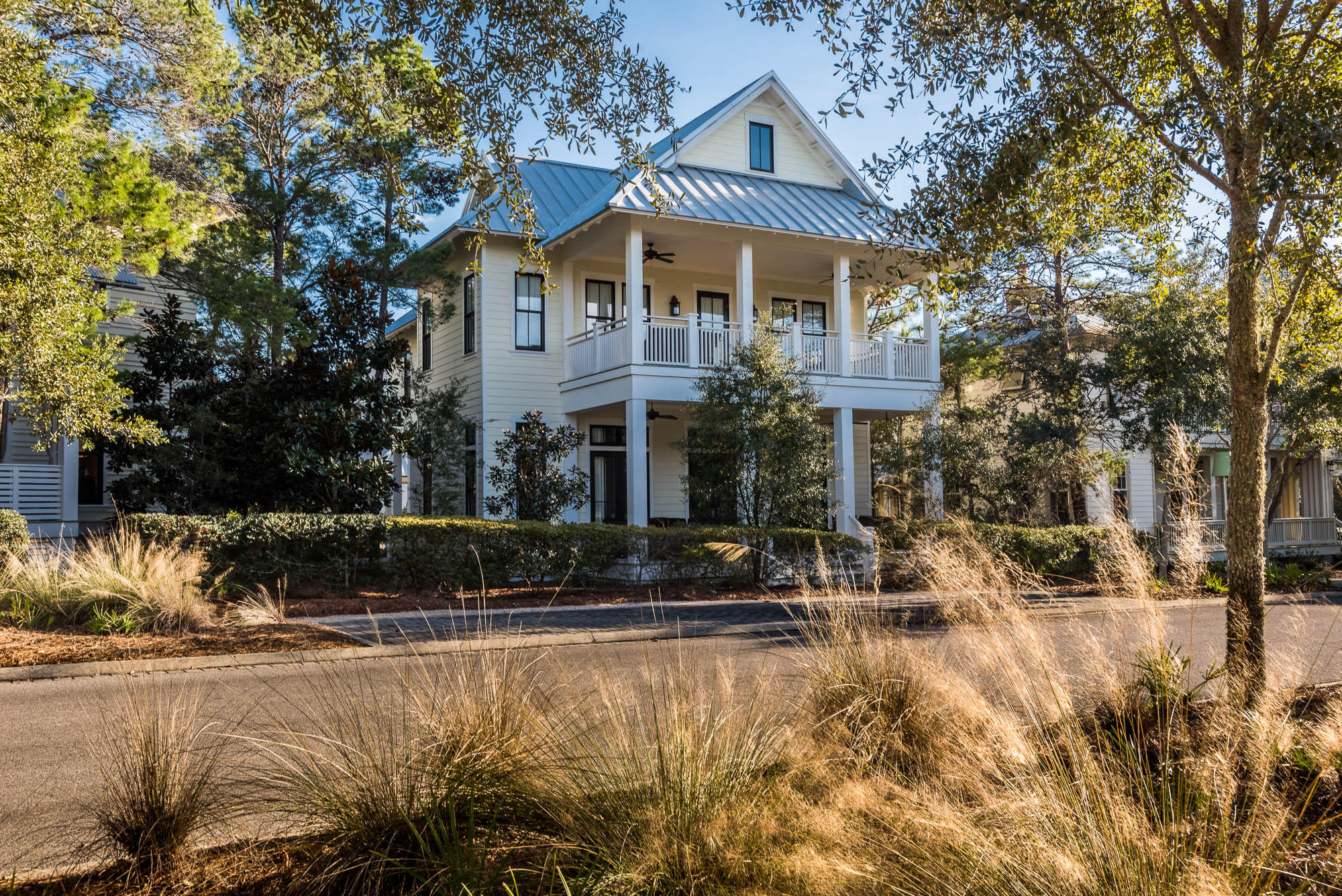 This charming 5 bedroom, 4 and -1/2 bath beach house found in Sand Hill, phase three of WaterColor, welcomes guests with an expansive, covered porch with abundant seating for your guests to gather and enjoy the mild Florida evenings. As you enter this home's sprawling great room with soaring ceilings, your gaze will be met by capacious windows letting in scores of natural lighting. The spacious living area was made to gather; a great spot where memories can be made for years to come. The large dining area with seating for eight provides another gathering spot where your family will continue to create memories over meals together for many generations to come. The open concept kitchen with stainless steel appliances, a Thermador 6-burner gas range and vented hood, Sharp Microwave drawer, generous storage, farmhouse sink and large Center Island, which also doubles as a perfect spot to enjoy breakfast before heading out on a bike cruise through Seaside! Also on the main level, you can find a master bedroom that opens up to a private porch and is equipped with a walk-in closet with built-ins and a master bath with all the bells and whistles; double vanities, water closet, and garden tub. The main floor's bona fide mud room is well-appointed with a built-in laundry area and ample storage to tackle your family's biggest messes! Guests can also enjoy the conveniently located half bath on the first floor. As you climb the stairs to the second floor of this beach house, you are greeted with a full bath attached to a spacious bedroom with two twin beds and a large closet with built-ins. Across the hallway, the expansive bedroom's vast windows allow in tons of natural lighting, as well as, room for the large closet and full bathroom with a walk-in shower. Off of the main hallway to the front of the home is a private covered porch where you can enjoy your morning cup of coffee in solitude. On the second level of this home, you will also find a large bunk room and a second master bedroom and master bath with a walk-in closet with built-ins, his and hers vanities, water closet, garden tub and walk-in shower. This home's exterior is appointed with paver pathways and a covered parking area, bike parking, outdoor storage room, and an outdoor shower; perfect after a long day spent at the beach. Located in WaterColor's third phase, Sand Hill is a twenty-four homesite neighborhood encircling the community green and pool. Tucked between the beautiful beaches of the Emerald Coast and Western Lake, a natural coastal dune lake, the WaterColor community is rich in natural beauty. One might say that the WaterColor community's greatest amenity has been brought to us by Mother Nature; yet, should you be looking for more, you can join in on the community's diverse collection of award-winning amenities, activities and events and be just a short bike ride from Seaside and WaterColor shopping. Call The Beach Group today to schedule a showing!