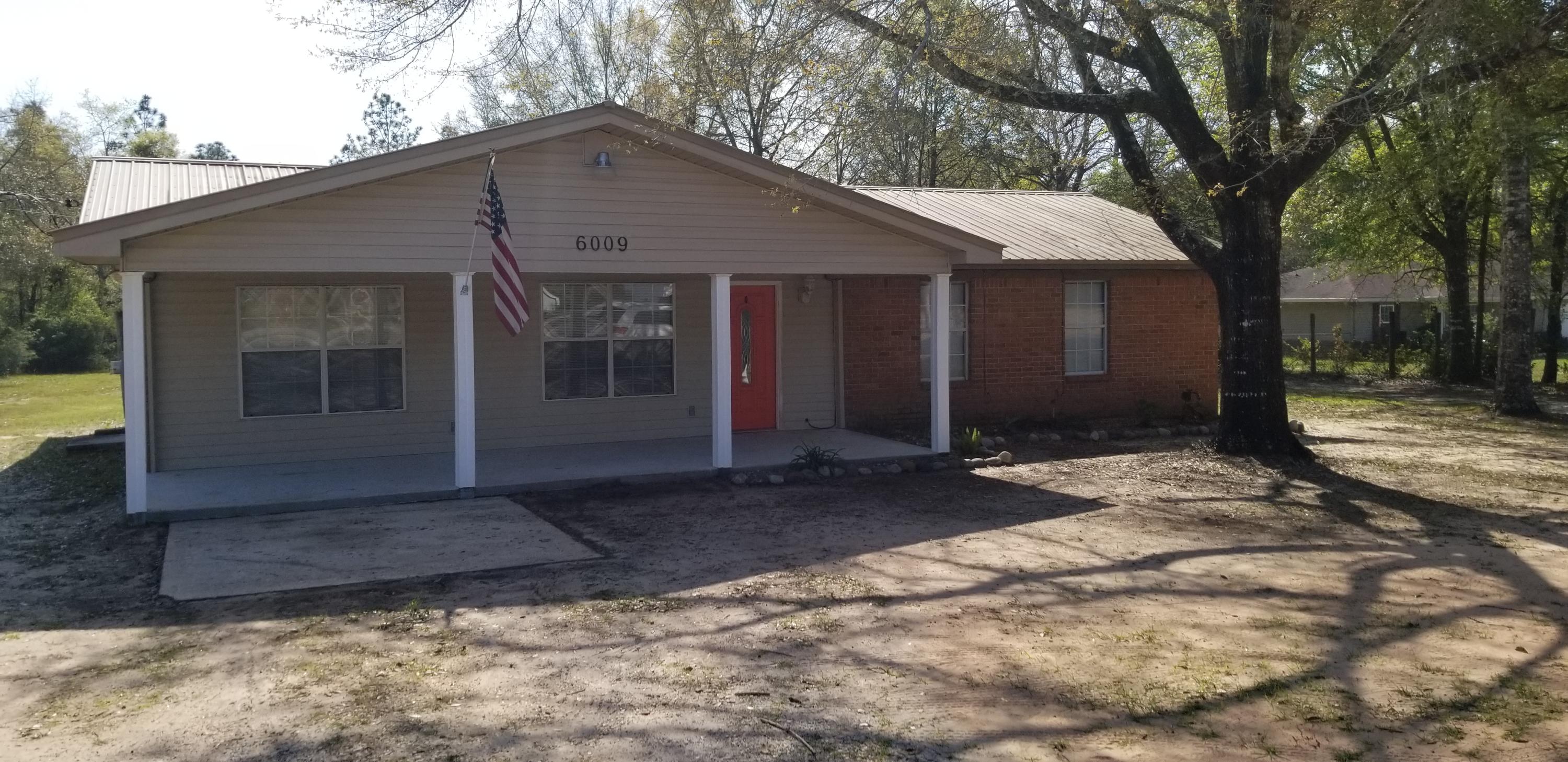 If you are looking for a place to get out of the hustle and bustle and still be close this may be the right one for you. Great kitchen with matching appliances and a pantry. The pantry door is painted with chalk pain so you can use it for lists or keep your little one busy while you are cooking. Extra room can be used as a dining room or den. And for relaxing outdoors you have not 1 but 2 covered porches. The large almost an acre lot has plenty of room for a detached garage and a pool. More pictures coming soon