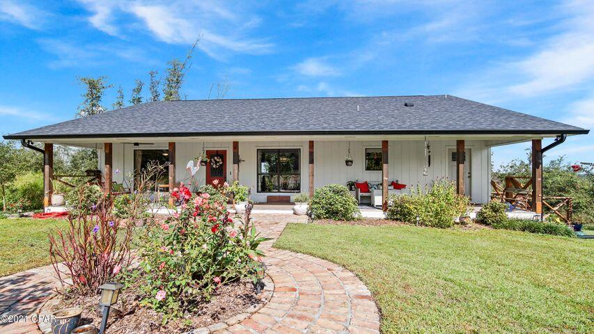 Get ready to enjoy tranquil and peaceful Country living! Spacious updated waterfront home located on Bear Creek, leading to Deer Point Lake. This charming 4 bed/3 full bathroom home features large front and back covered porches along the length of the home and all rooms at the back of home have water views. Master bedroom has great water view, large walk-in closet and French doors leading to covered porch. Kitchen has stainless steel appliances, quartz countertops, lots of cabinets and large pantry. Beautiful 3/4'' character grade Hickory flooring in main living area and bedrooms on the first floor. Basement level has a 600sqft Mother-in-law suite with kitchenette and new bathroom with claw foot tub. Oversize 2 car garage with large workshop also on Basement level. Situated on 1.05 acres with fenced back yard, a chicken coop and only 1.5 miles to public boat ramp. Seller will provide One year AHS Home Warranty up to $500 with acceptable offer. Home has a Transferable Termite Bond and an extensive list of upgrades including full Septic Tank replacement(2017), New Roof (2019), New HVAC system (2020). Call Today!!! All measurements should be verified by Buyer if deemed important.