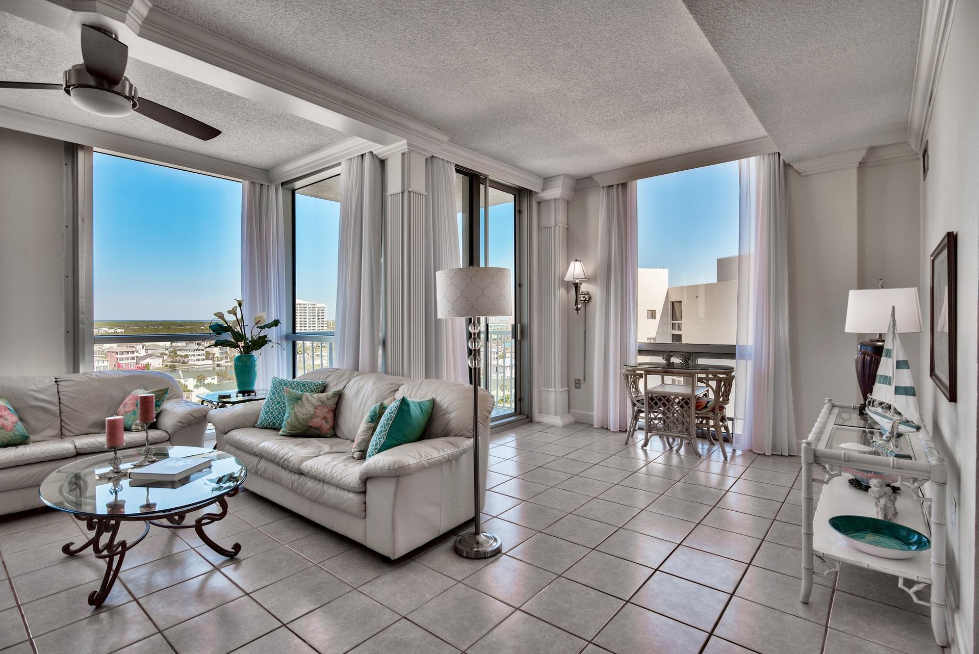 Introducing Shoreline Towers 2121 - A large 1800-SF, 3 BR/2 BA penthouse unit on the 12th floor of desirable of Tower 2 at Shoreline Towers. Located in the heart of Destin on Holiday Isle, with Gulf, Harbor, and Bay views. Stunning at night to see the City of Destin laid out before you. Shoreline Towers is in close proximity to top restaurants, recreation, and retail. There is 460 feet of pristine beach frontage, with a new beach walkover located directly from Tower 2.
Tower 2 at Shoreline Towers is positioned Gulf-front and this penthouse unit, while not directly Gulf front, offers fantastic Gulf views and expansive views of the city of Destin including the Bay and Harbor. Another rare treat is covered parking with an assigned parking space in the garage and assigned storage. The assigned storage closet is located on the 12th floor close to the unit just by the elevators and is perfect for storing beach gear. There is also an owner's closet inside the unit by the entry that can be locked out. Additionally, a heated and cooled 9x6 storage area on the ground floor of the parking garage may be applied for through the Association for a one-time $500 fee. Perfect as a permanent residence or vacation home/rental, Unit 2121 has 9 1/2-foot ceilings throughout, floor to ceiling windows in the living area, with an outside balcony area offering exquisite views. In addition to having the extended ceiling height on the penthouse level, at 1,800 square feet, this is the largest floor plan at Shoreline Towers, making this unit ideal for primary residence. The unit was JUST PAINTED throughout for a fresh look, has a newer HVAC system and is being sold fully furnished and decorated. If desired, the unit can be renovated to open up the kitchen to the living area. Interiro features open living areas with a wood-burining fireplace, three spacious bedrooms - two with Gulf views and a master bedroom that has a private bath & dressing room. Interior pantry and owner's closet storage can be locked as an owner convenience. This unit was recently on the Shoreline Towers onsite rental program and rental history can be provided. Currently it is not on the rental program to facilitate showings at any time.

Shoreline Towers is a gated resort that offers large grounds, a heated pool, sauna, fitness center, recently updated large community clubhouse with full kitchen & bar that can be reserved for your private functions or social events, BBQ and picnic area, a fishing lake, two lighted tennis courts, shuffleboard, 24-hour security and patrol with a guarded gated entrance, onsite rental and HOA management offices. There is an additional parking area for boats and RV's and this complex has a handicap accessible beach walkover as well as entry to the pool. There is a no pet policy. You are in a prime location in Destin close to many dining, shopping & entertainment options. 

This is a great opportunity to own a penthouse level large 3BR condo in central Destin for well under $400K. Schedule your viewing SOON and live the Destin lifestyle in spacious and serene surroundings!