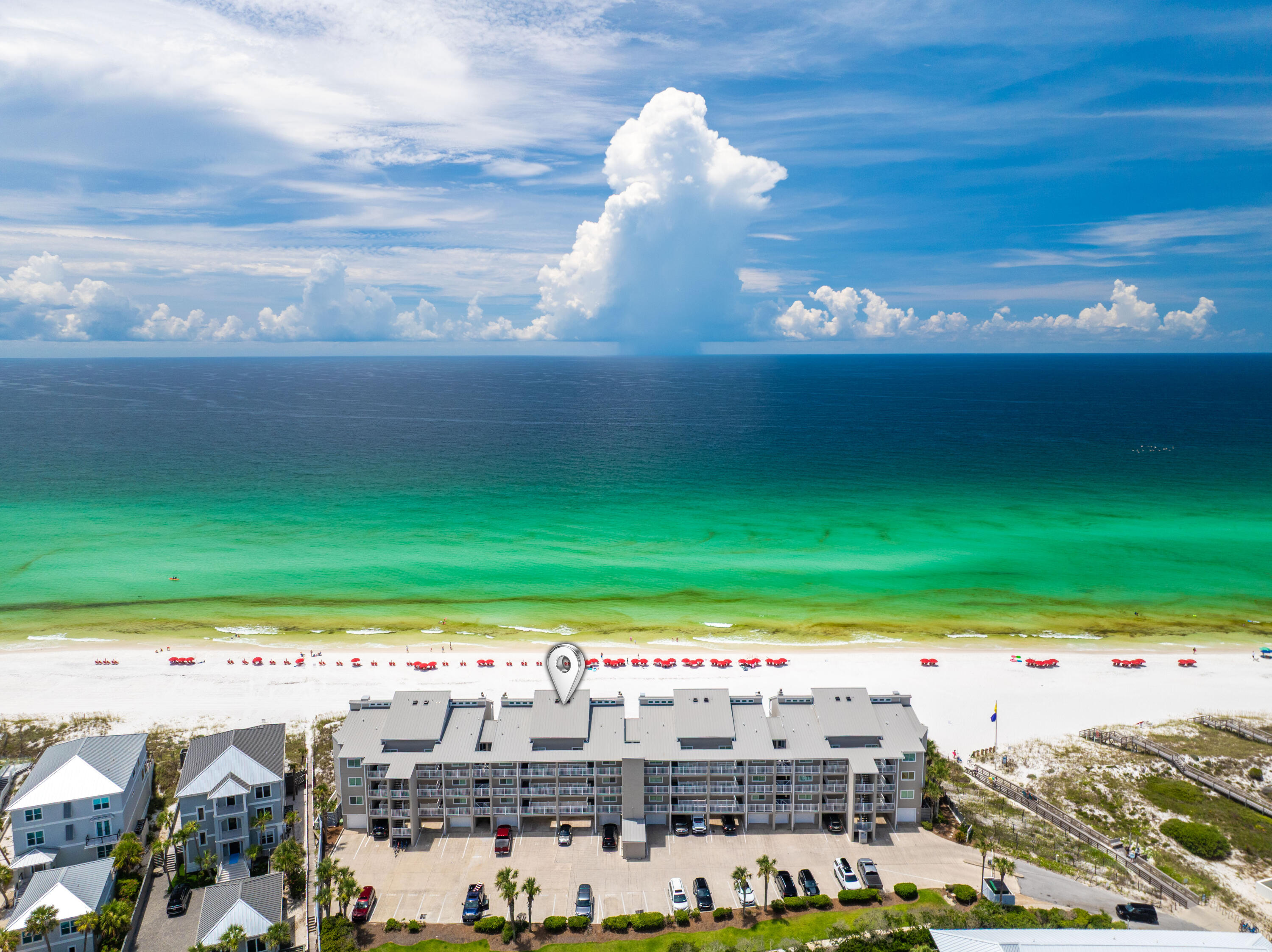 Gulf-front elegance meets exclusive privacy in this rare, low-density, gated enclave of just 24 units. Perched 19 feet above the shoreline, this residence offers sweeping, unobstructed views of 400 feet of private white-sand beach and emerald Gulf waters. Enjoy seamless indoor-outdoor living with an oversized 8x28 balcony featuring direct access to the sand and gulf. Recently renovated kitchen and spa-like primary bath elevate the experience. Thoughtfully designed with a King primary suite, Queen guest room, and an additional guest suite with two Queen beds.