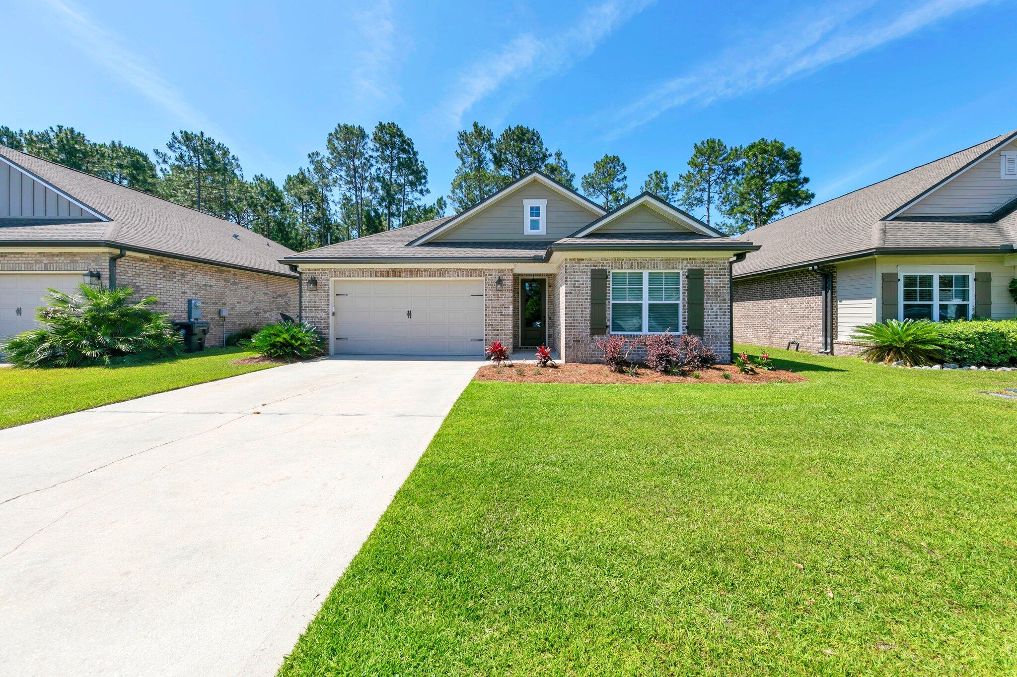 Motivated Seller! Will pay 3% of buyer's closing costs with acceptable offer! Located in the quiet, bayou-side community of Marina Village, this 3-bedroom, 2-bathroom, 1,779 sq ft home offers quality construction and comfortable living.  Built by local builder Randy Wise Homes, known for solid craftsmanship and attention to detail, this newly painted home includes an all brick exterior, low-E vinyl windows, covered front and back porches, a 2-car garage, and an automatic sprinkler system.

Inside, the home features an open layout connecting the kitchen, living, and dining areas, with 9-foot ceilings, crown molding, and oil-rubbed bronze finishes throughout. 
The kitchen and bathrooms are finished with granite countertops, and the flooring includes a mix of laminate, tile, and carpet.  The master bedroom includes a vaulted ceiling, a spacious walk-in closet with shelving, and a spacious tiled bathroom with a double vanity and an extended-size tiled shower. Secondary bedrooms are generously sized, and the second bathroom includes a linen closet. The laundry room adds convenience with a large utility sink and cabinet storage.

The garage has been upgraded with finished flooring and dual ceiling fans, offering flexible space that could be used as a home office, workout room, playroom, or for parking vehicles. The backyard is fenced, and the covered patio provides a comfortable outdoor space.

Community amenities include a neighborhood pool and pool house, dog park, playground, and three scenic ponds with a dock for fishing. Just a half-mile walk leads you to Freeport Marina, where you can catch the sunset, watch dolphins, or fish.

Conveniently located less than 4 miles from local schools, grocery shopping, dining, and more.  This home blends peaceful bayou living with everyday convenience. Bonus, this home is 15 miles to the beach!

Contact us today for a private showing.