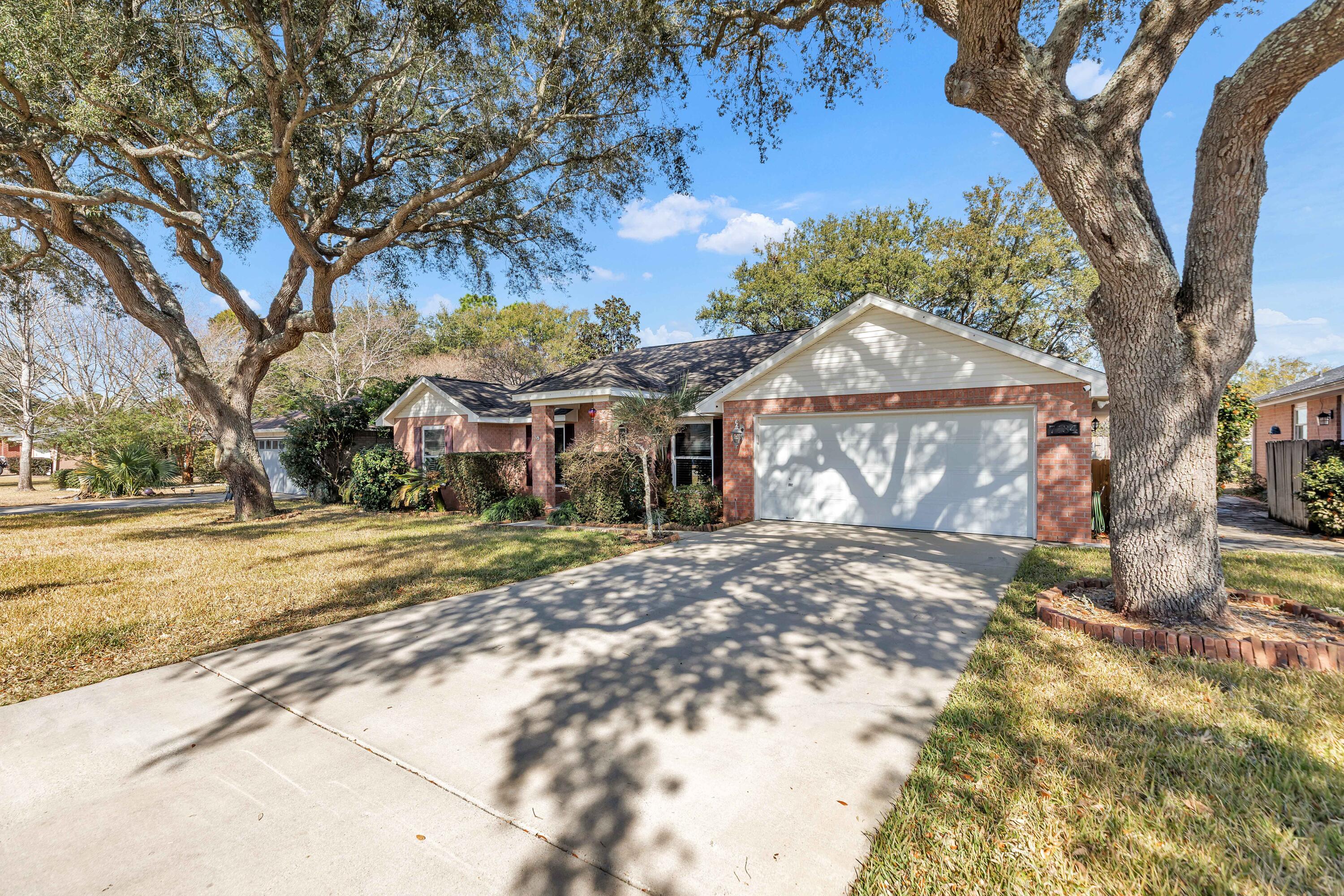 This beautiful four-bedroom, two-bath home located in Navarre, just a short drive from the pristine Gulf Coast beaches. This well-maintained property features a spacious open living area with tile floors and a cozy fireplace, perfect for everyday living or entertaining. The kitchen is updated with stainless steel LG appliances and stunning granite countertops, offering both style and functionality.

Major updates include a roof installed in 2019, updated windows and siding glass door 2021. The updated primary suite boasts an updated bathroom with a soaking garden tub and a separate tile shower. Additional highlights include a two-car garage, fenced backyard, and a large sun deck ideal for outdoor gatherings. Located in the manicured Villa Danielle subdivision, this home combines comfort, quality upgrades, and a prime Navarre location. Updated hurricane windows and sliding doors with transferable warranty. Schedule your showings now to view this well-maintained home before it's too late.