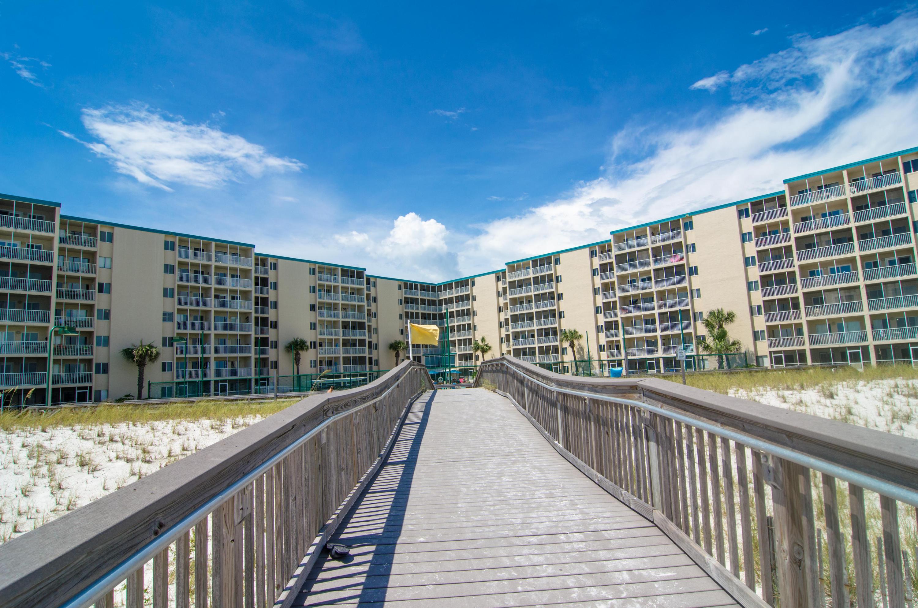 Totally remodeled 2 bedroom unit at the popular Holiday Surf and Racquet Club! Enjoy beautiful pool views from this gorgeous condo featuring: tiled floors throughout, new kitchen cabinets, sleek granite counters and nicely furnished. This unit has a seasoned rental history and is turn-key! Holiday Surf & Racquet Club has tennis courts, shuffle board, boardwalk, his and hers exercise rooms, beautiful lobby, landscaping throughout the complex and game room! This is the only two bedroom on the market! Don't delay and capture your piece of paradise today since this unit had rental income of over $21K in 2015!