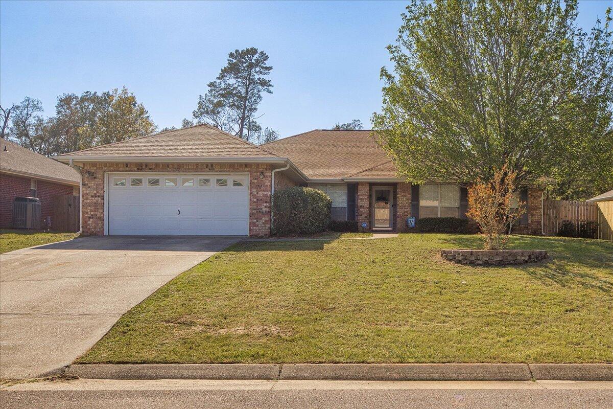 *Brand new roof!* Welcome home to this beautiful almost 2600sqft 4 bedroom home with TWO additional flex rooms located in the desirable Waterstone subdivision convenient to Hurlburt AFB, shopping, and the sugar white sand beaches of the Emerald Coast. You'll love the well maintained neighborhood with underground utilities and HOA fees at only $140/year! If you're looking for a spacious home then look no further - with 4 full bedrooms in a great split floor plan layout along with a formal dining room (great for use as a flex room) AND office/den both with hard surface flooring this has all the space you need on a quarter acre lot! This home boasts a huge living area that includes a fireplace, an enormous eat in kitchen, and more cabinet space in the kitchen than you could dream of Relax in your spacious master retreat and enjoy TWO oversized walk in closets, as well as double vanities, a stand up shower, and separate soaking tub. The other 3 bedrooms are generously sized with ample closet space and a second bathroom. Outside you'll find a fully fenced in yard with room to enjoy and a convenient yard building with a private backyard view. Come see your new home today! Roof 2024, water heater 2020.