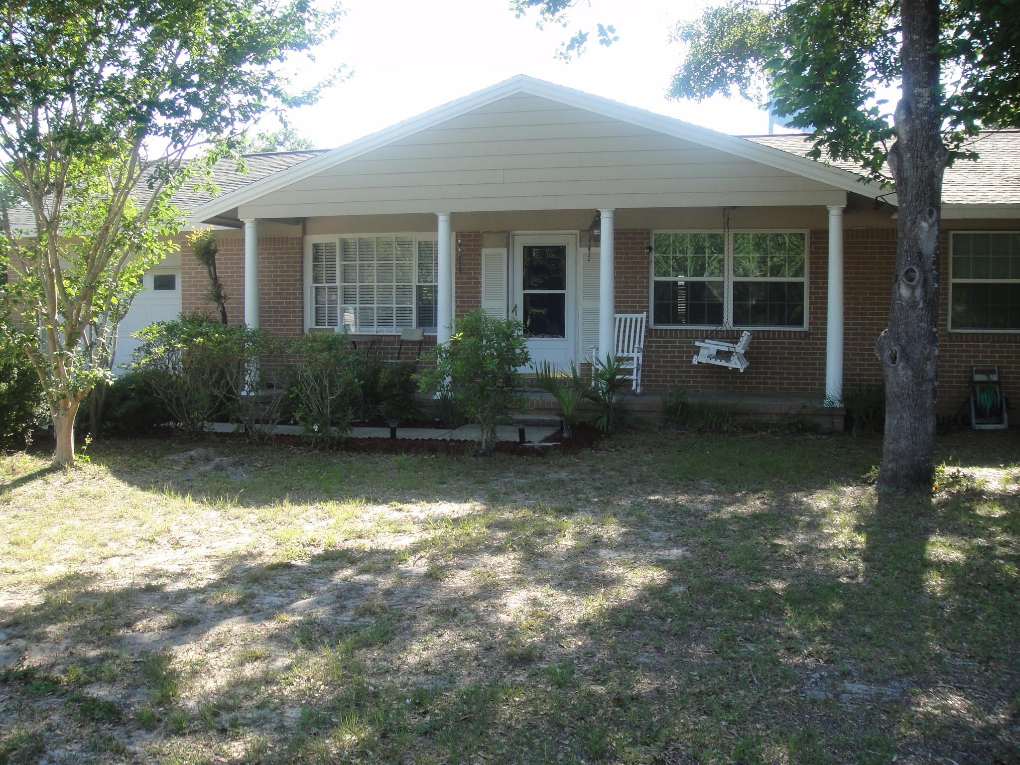 This home is on a very large, fully fenced, lot just under 1/2 an acre located in downtown Destin and just minutes away from schools, shopping, beaches and great restaurants. The home has three bedrooms and two full bathrooms featuring wood floors with a very large family room with a half bath. There is a huge outdoor deck perfect for cookouts and entertaining family and friends. Roof was replaced 3 years ago along with outside A/C unit. This extra large lot has the potential for sub-division or even re-zoning to mixed use to allow for a commercial project on the corner. There is also a separate detached garage with a one bedroom apartment above with it's own bathroom, kitchenette and washer dryer hook-ups. The home is being offered ''AS IS'' with right to inspect.