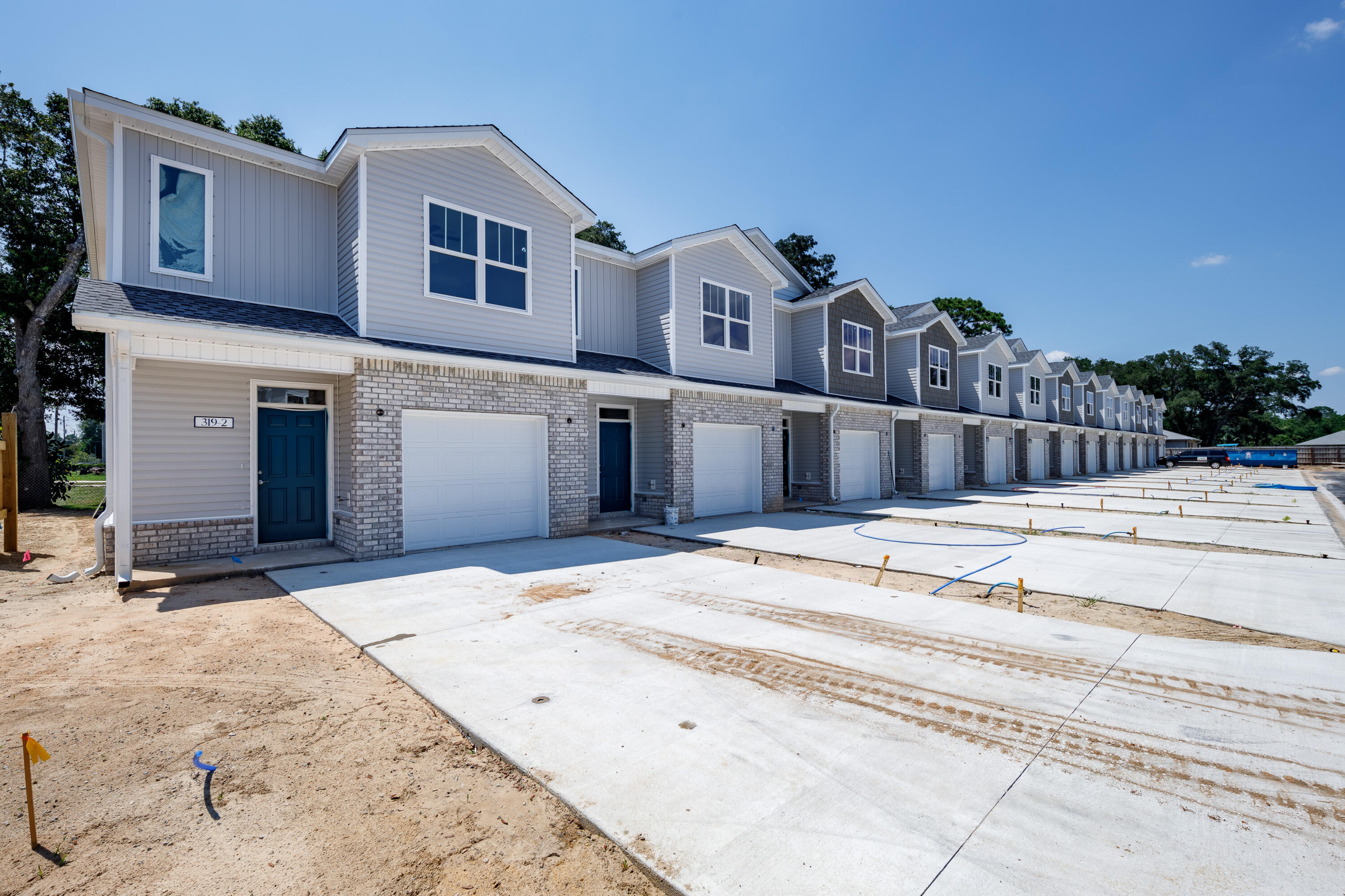 Brand NEW townhomes for sale in the heart of Fort Walton Beach! Orange Place offers 26 units in total, each with 3 bedrooms/ 2.5 bathrooms with an individual garage. This is unit 319-4, which is the second unit on your left. Downstairs you will find the living room, half bathroom, and a contemporary kitchen complete with Bianco Carrera Quartz countertops, soft close cabinets, and stainless steel appliances including a fingerprint resistant stainless steel side by side refrigerator. You will find LVP throughout the living and bathrooms, and plush carpet for comfort in the bedrooms. You are only a short drive away from the beaches, shopping, restaurants, Air Force Bases and more. There is an insurance quote attached for only $130.22/month. Make an appointment to come see a unit today!